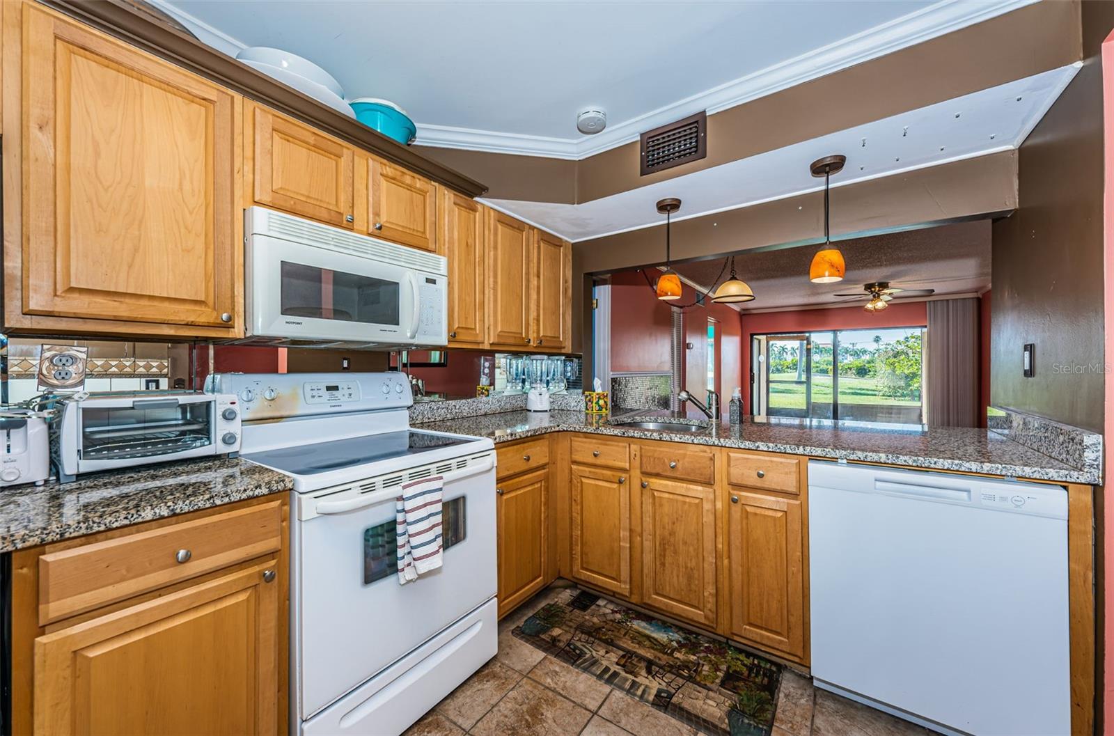 Kitchen with Pretty Cabinetry and  Granite Countertops