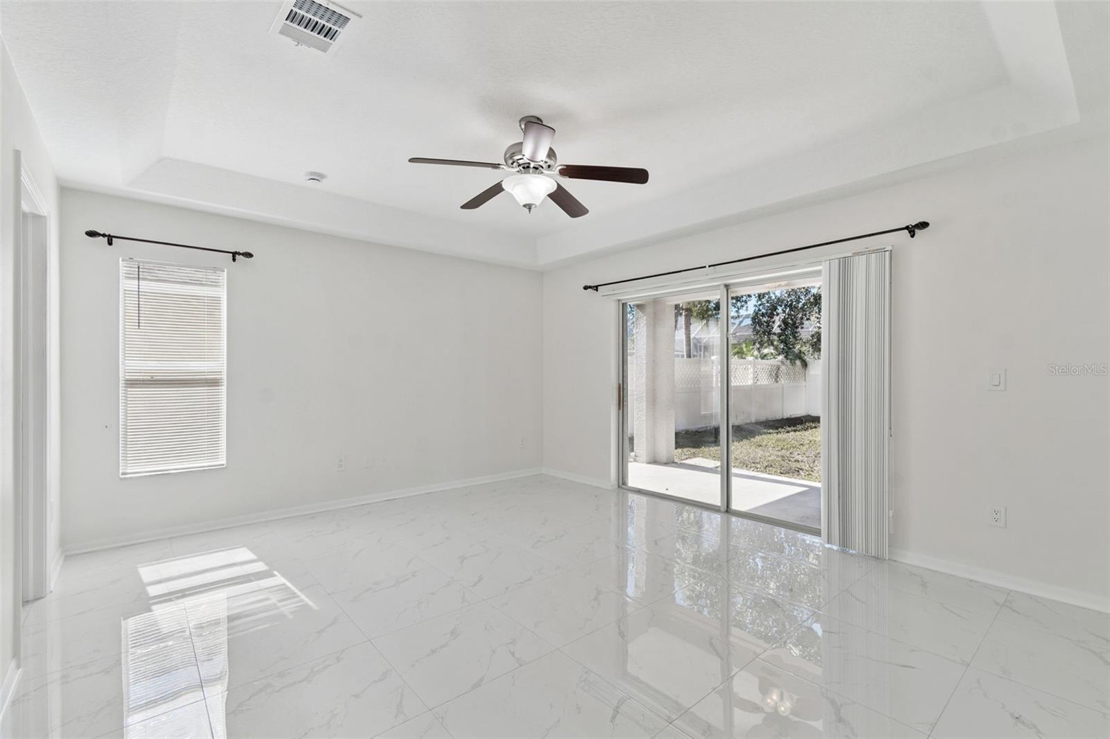 Primary Bedroom with sliders to backyard/patio