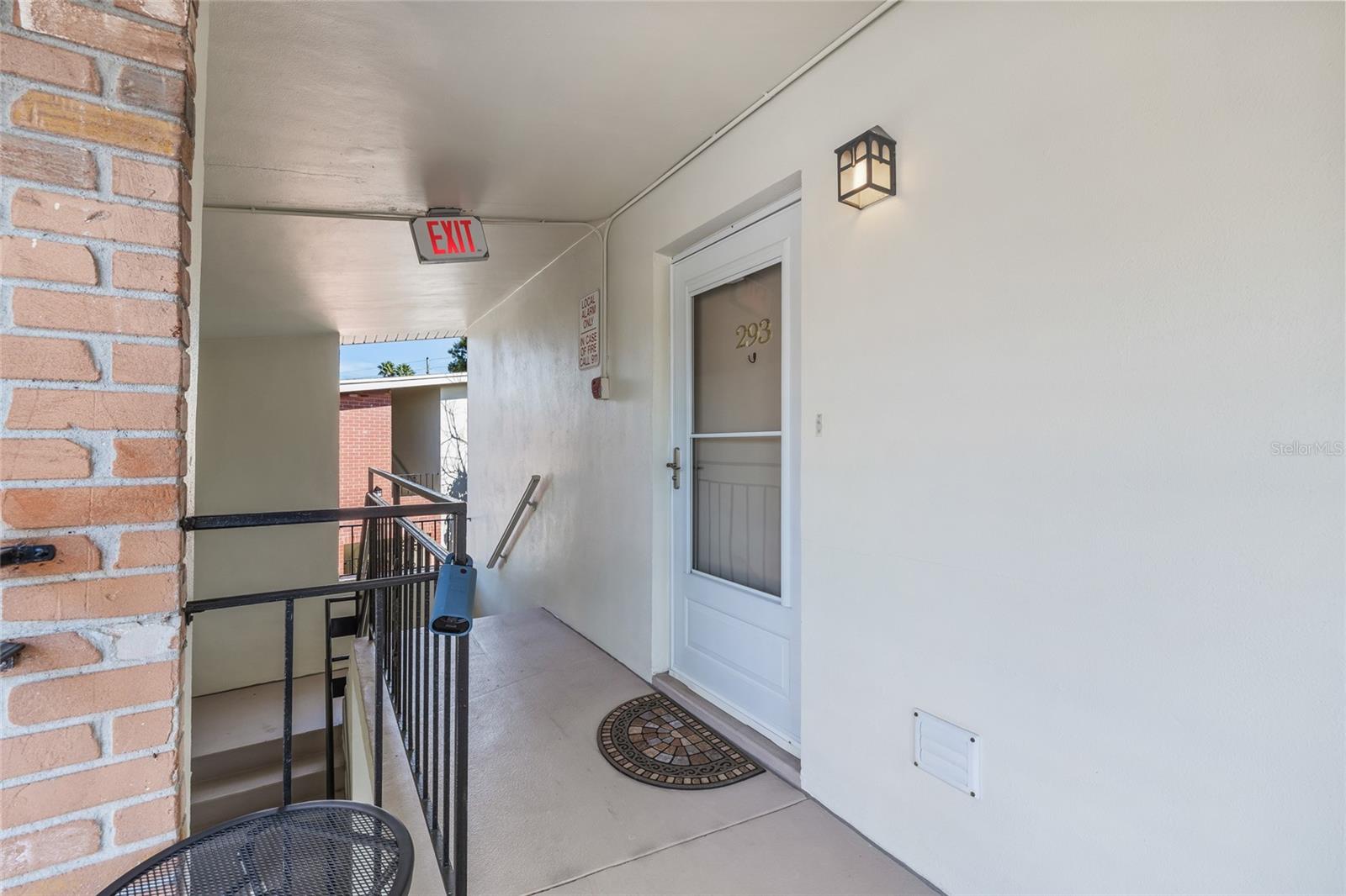 This condo has the first door after the stairs to the second floor.