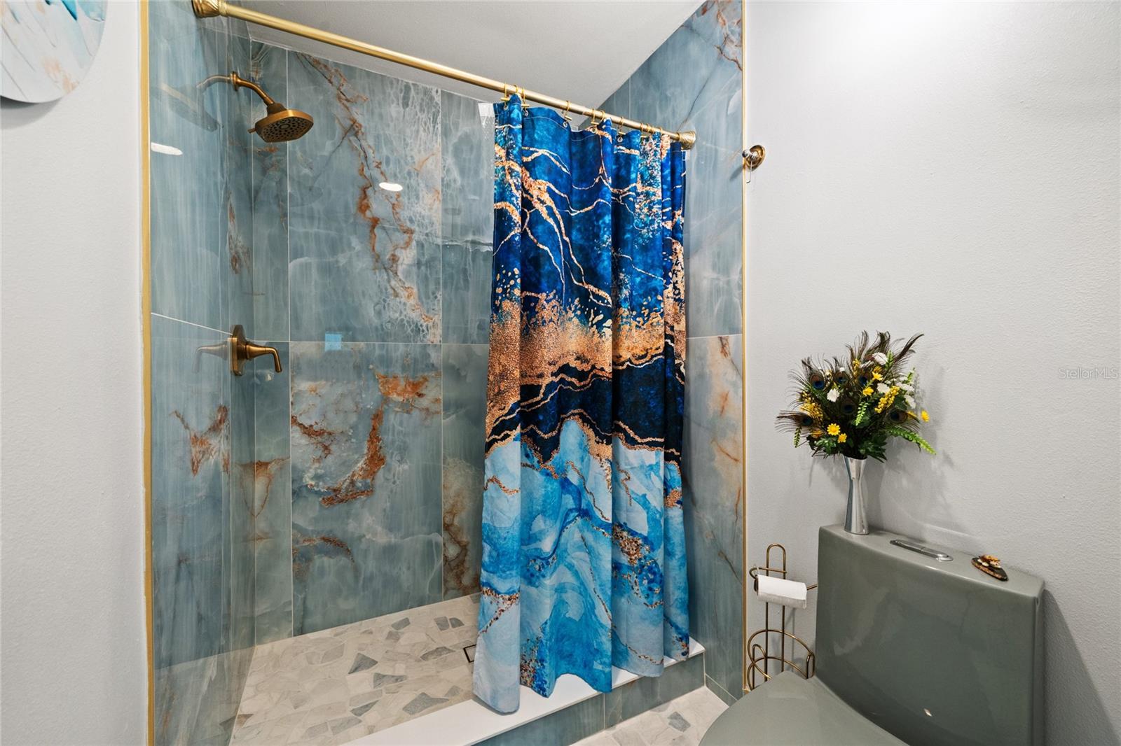 COMPLETELY UPDATED MASTER BATHROOM WITH BEAUTIFUL NEW TILE, TOILET, PAINT, FLOORING