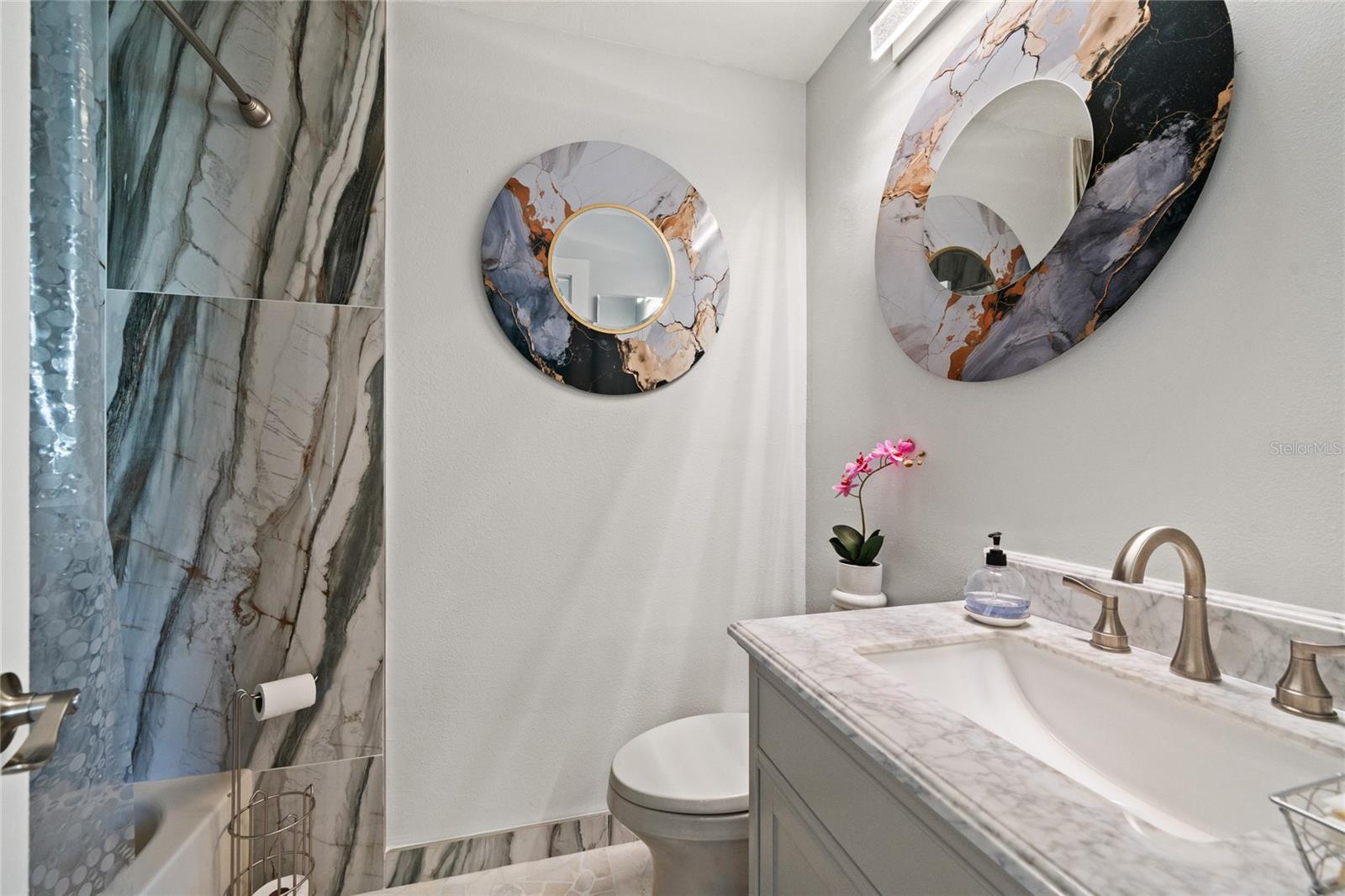 COMPLETELY UPDATED GUEST BATHROOM - NEW TILE CABINET, TOILET, PAINT AND FLOORING