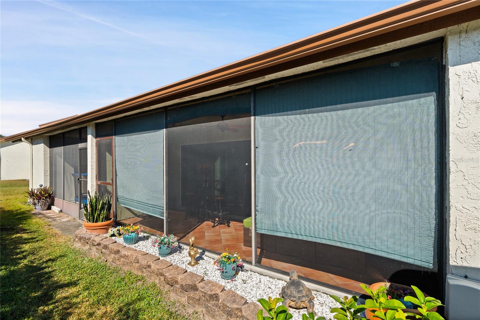 BACK YARD VIEW OF LARGE SCREENED PATIO