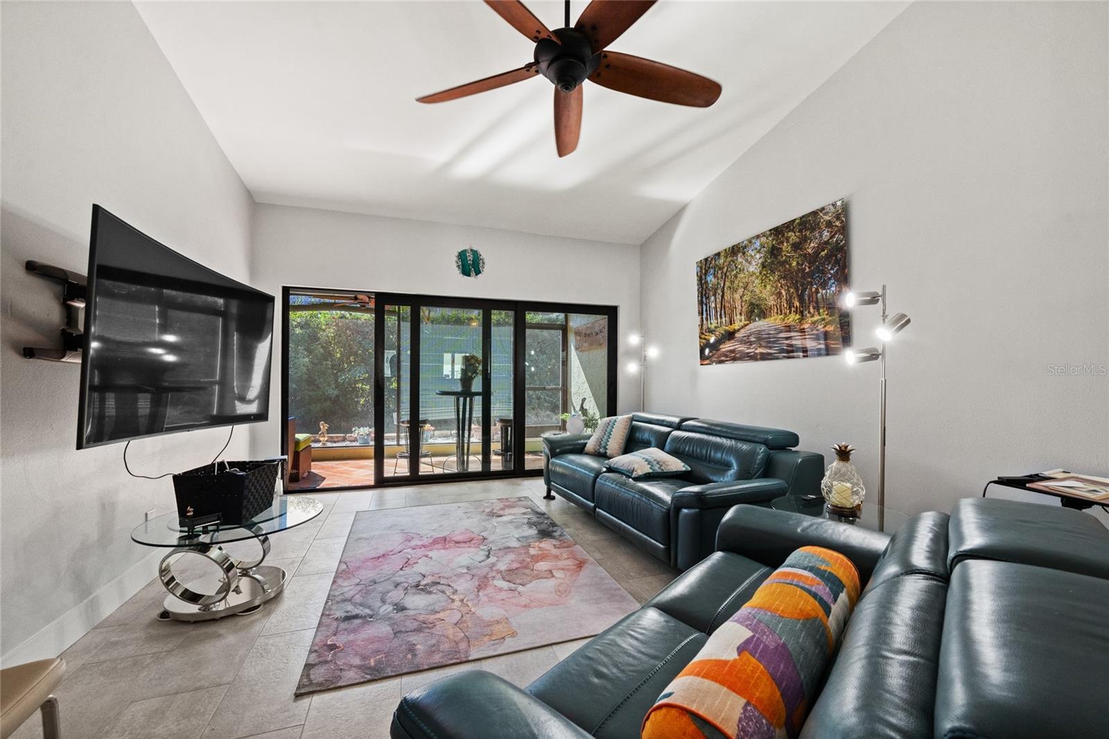 LIVING ROOM WITH NEW TRIPLE SLIDERS, NEW PAINT AND NEW FLORING