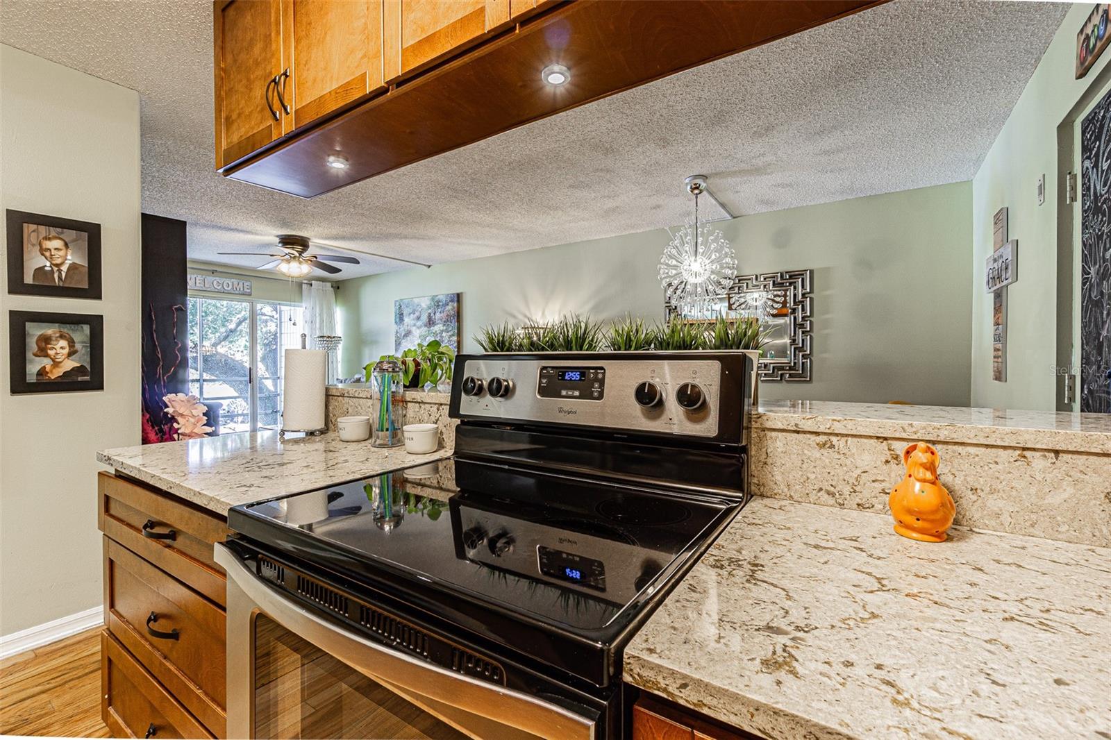 Stainless steel appliances and view to dining room