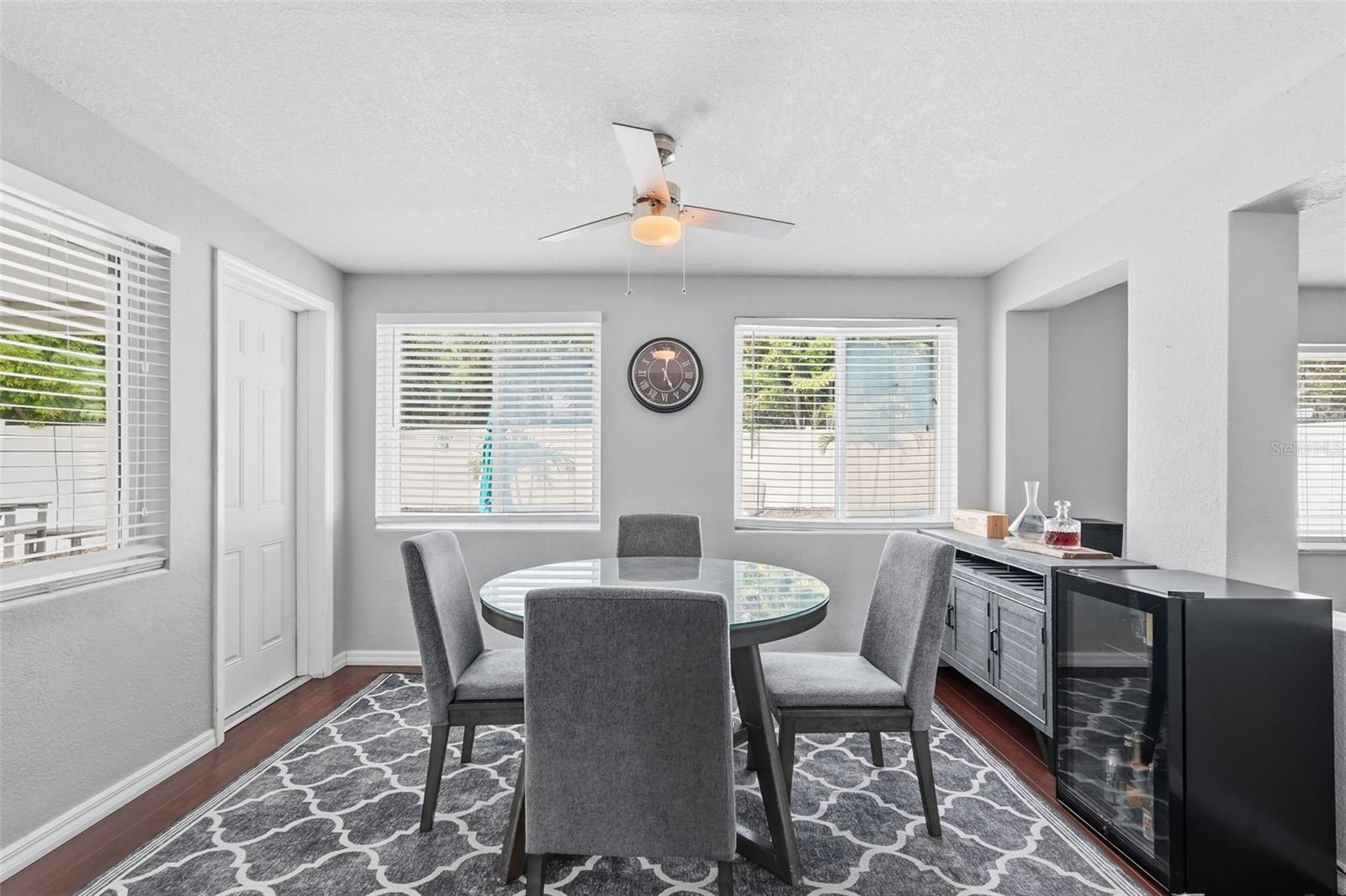 Dining room off the kitchen with a door leading to the backyard.
