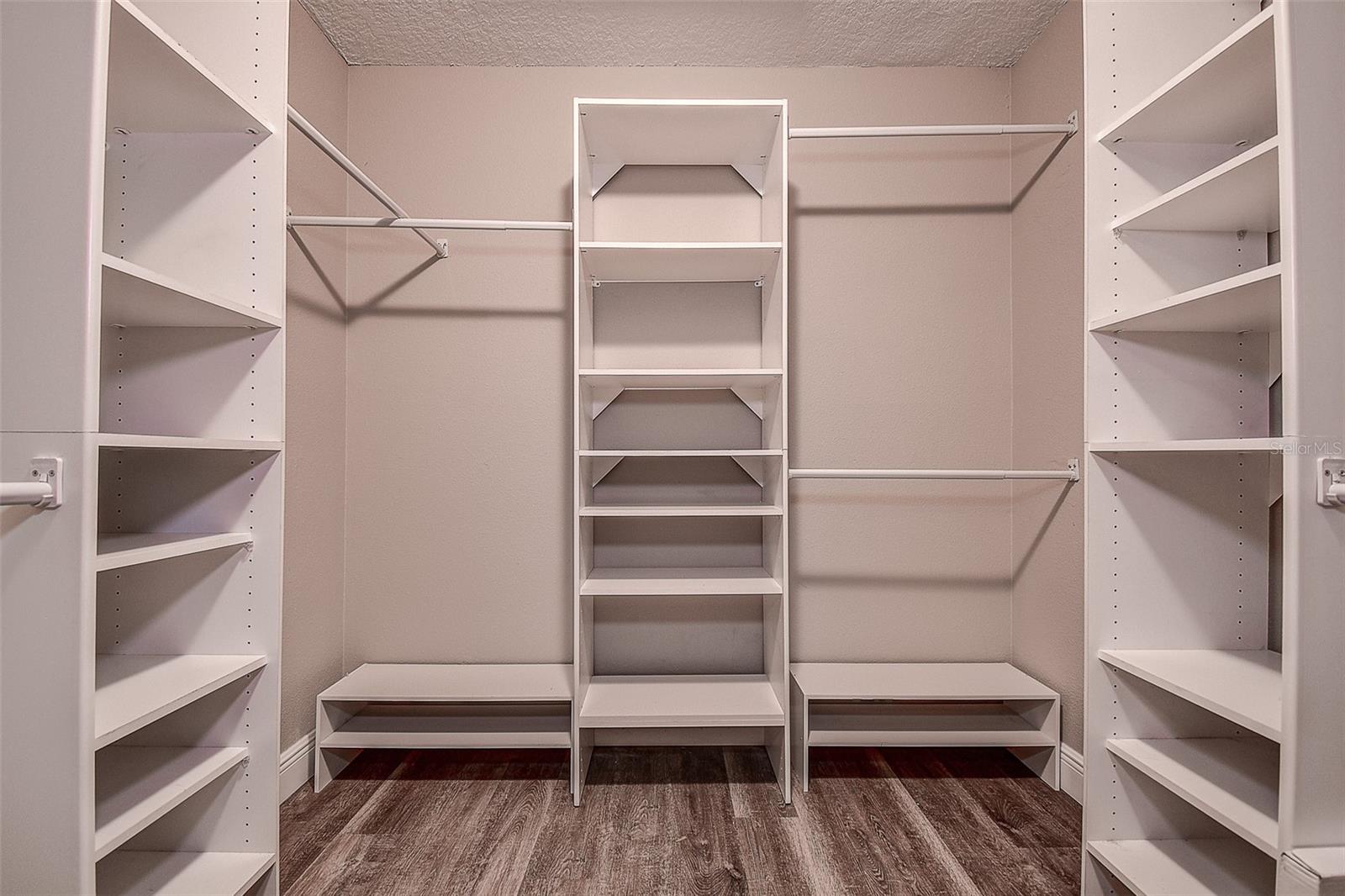 Primary bedroom walk-in closet