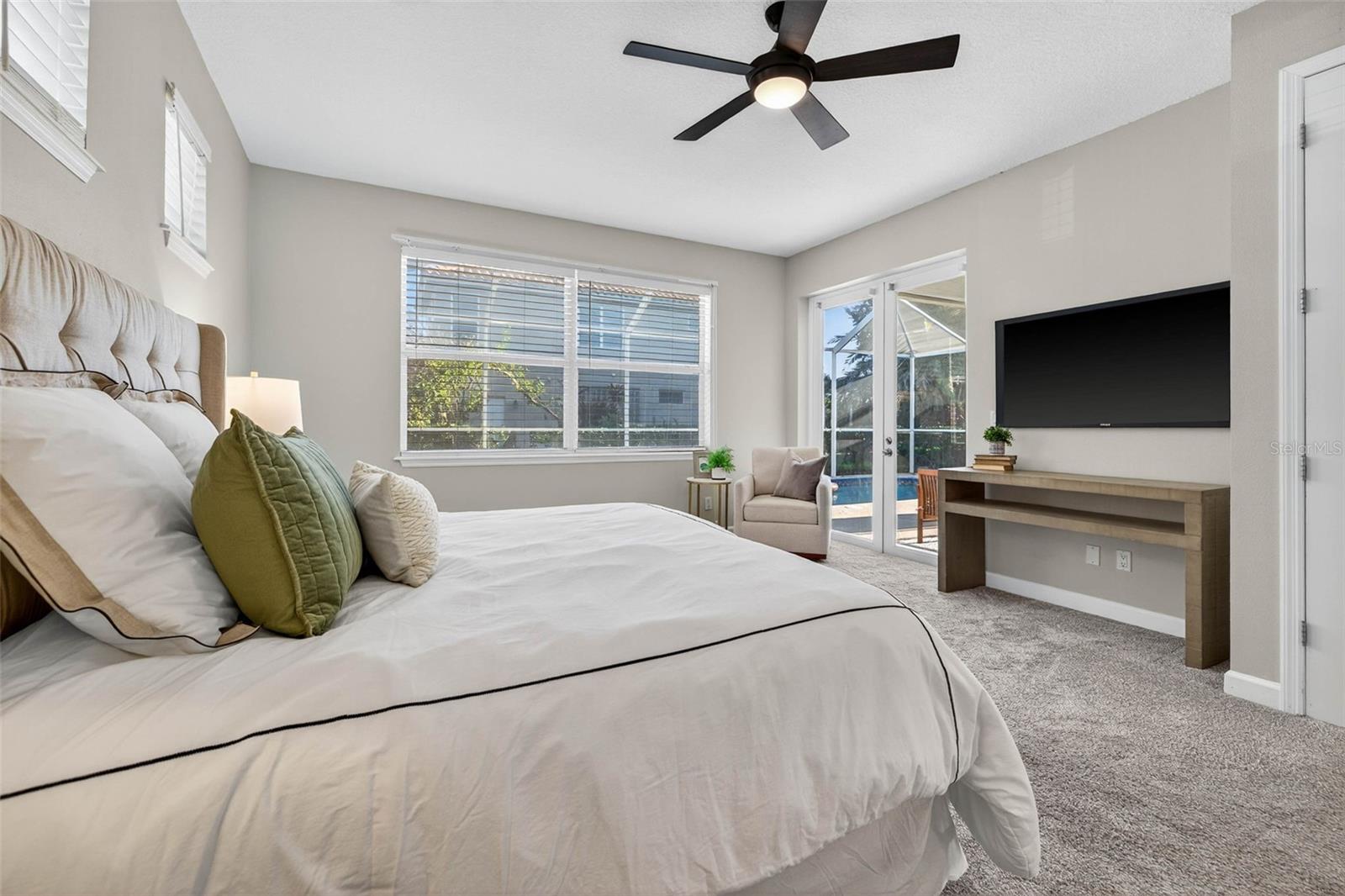 Downstairs Primary Bedroom with access to pool