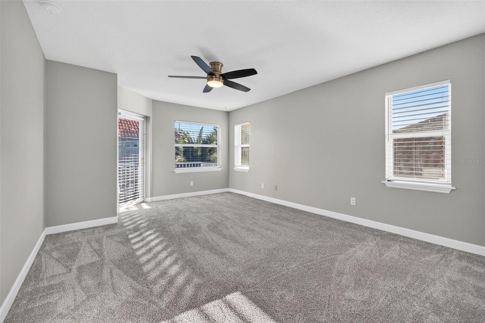 Upstairs Bedroom with Ensuite Bath and access to Balcony with Pool/Pond Views