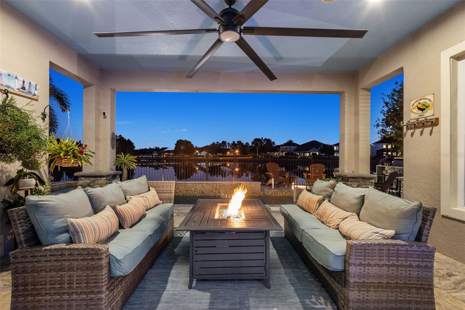 Covered lounge area with fire feature & tropical feel