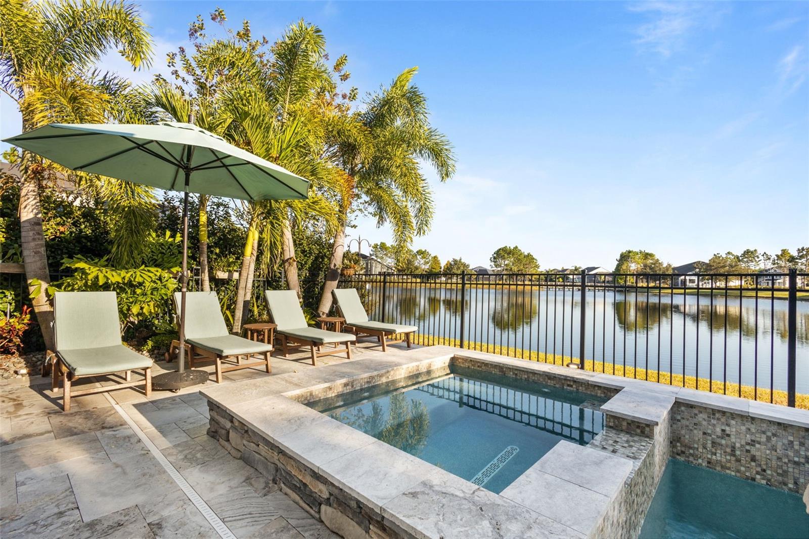 Peaceful pond views from the backyard oasis