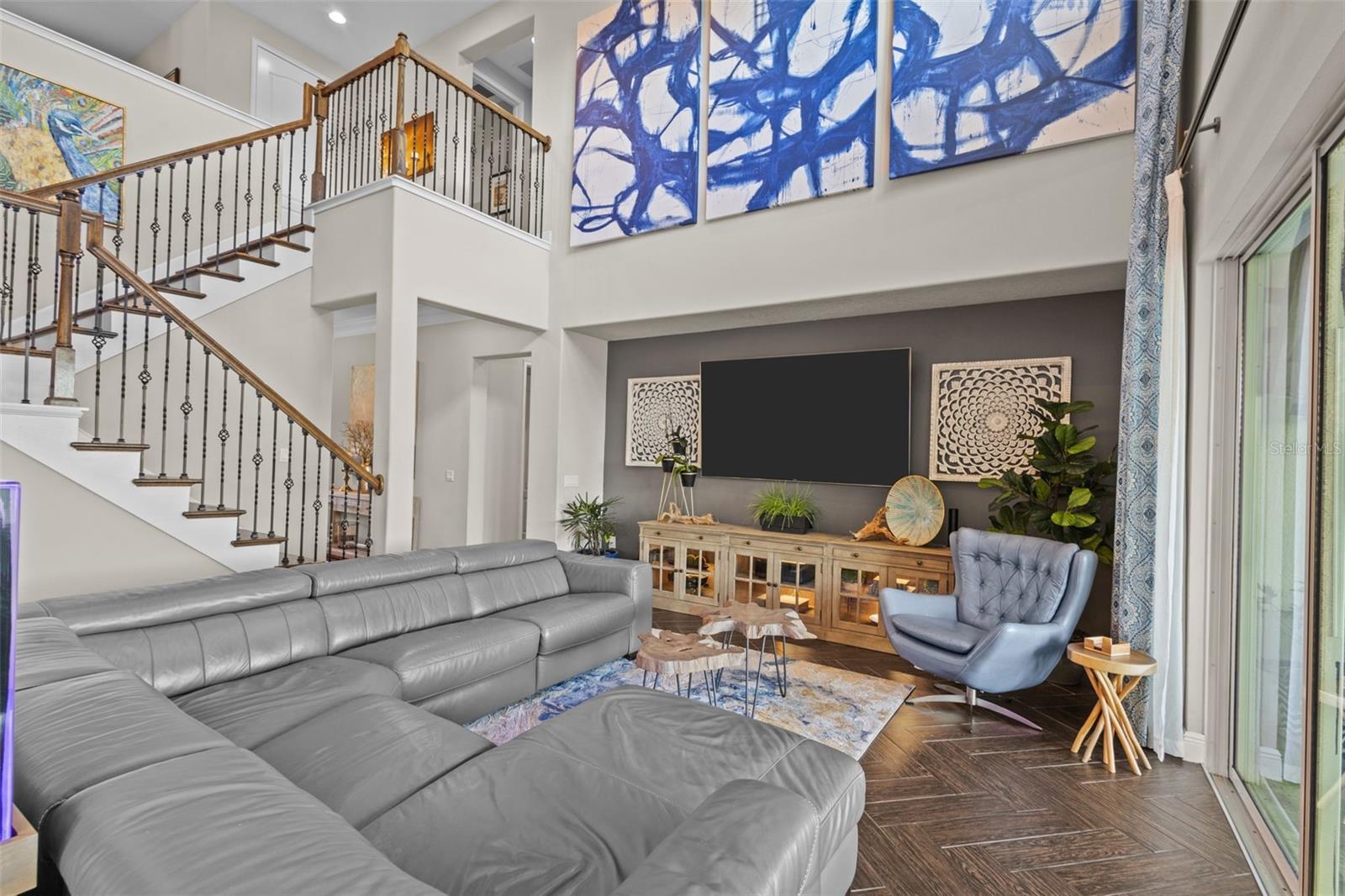 Soaring ceilings, exposed beams & pond views