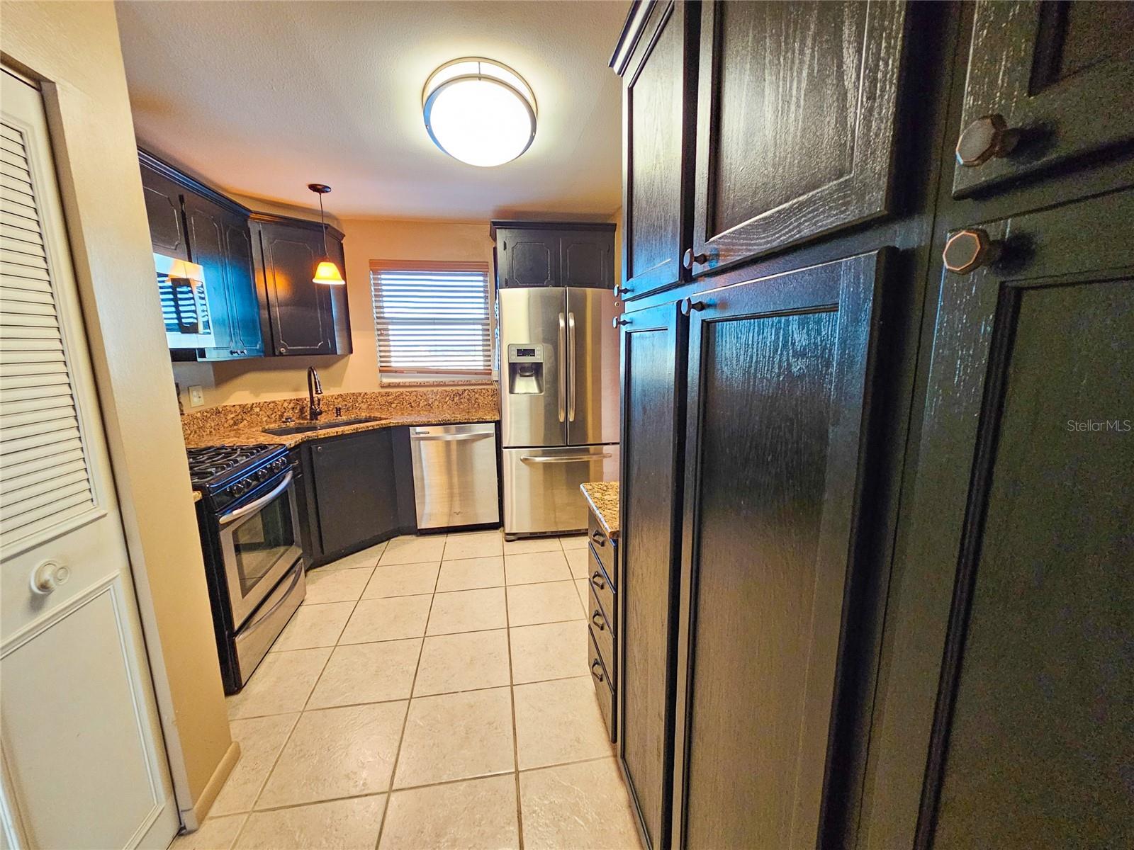 Kitchen Area w/ built in Storage and pull outs