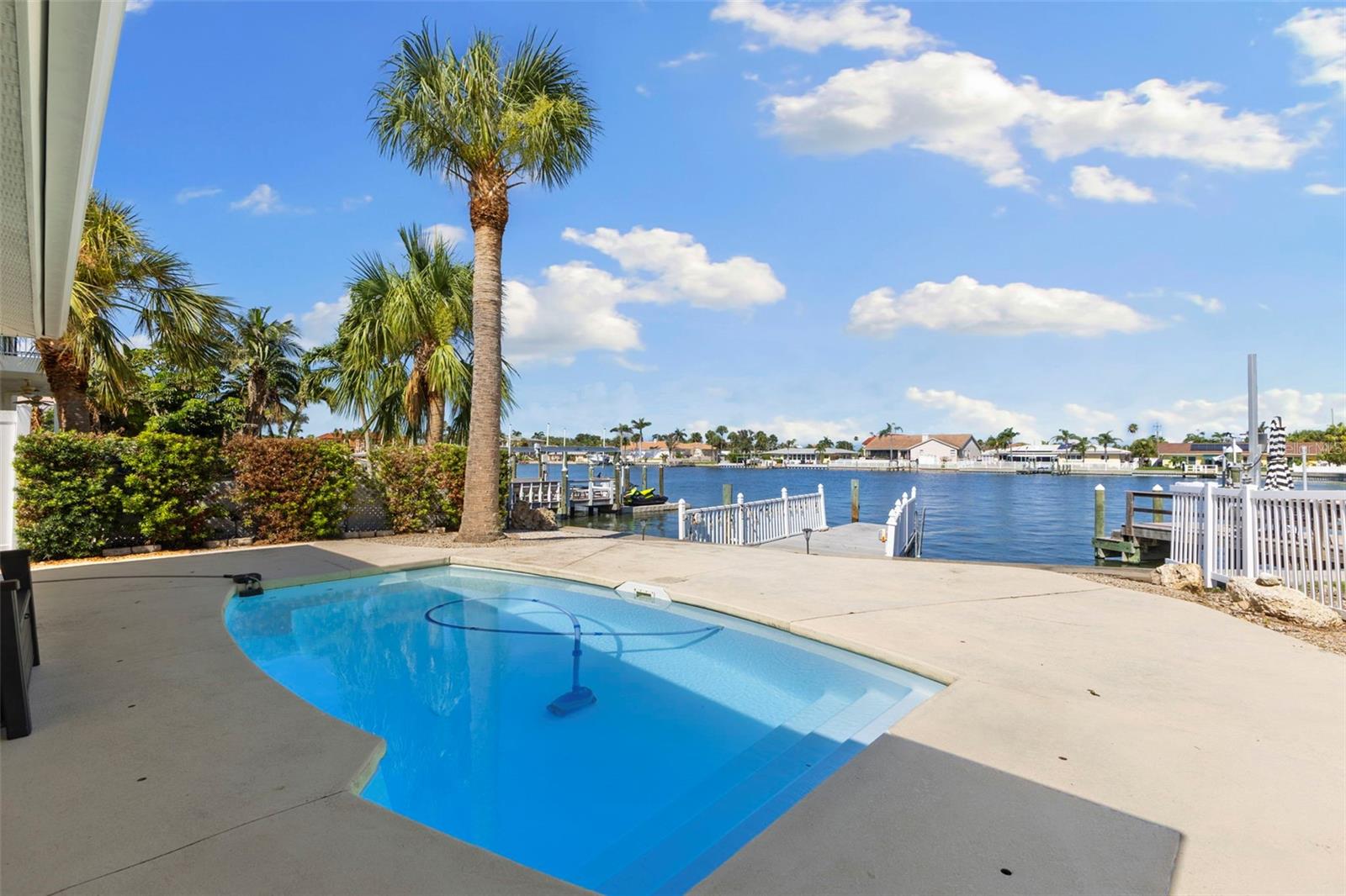 Pool Area Overlooking The Saltwater Canal and Dock