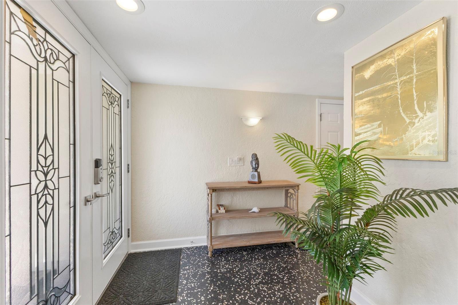 Entryway with black Terrazzo flooring