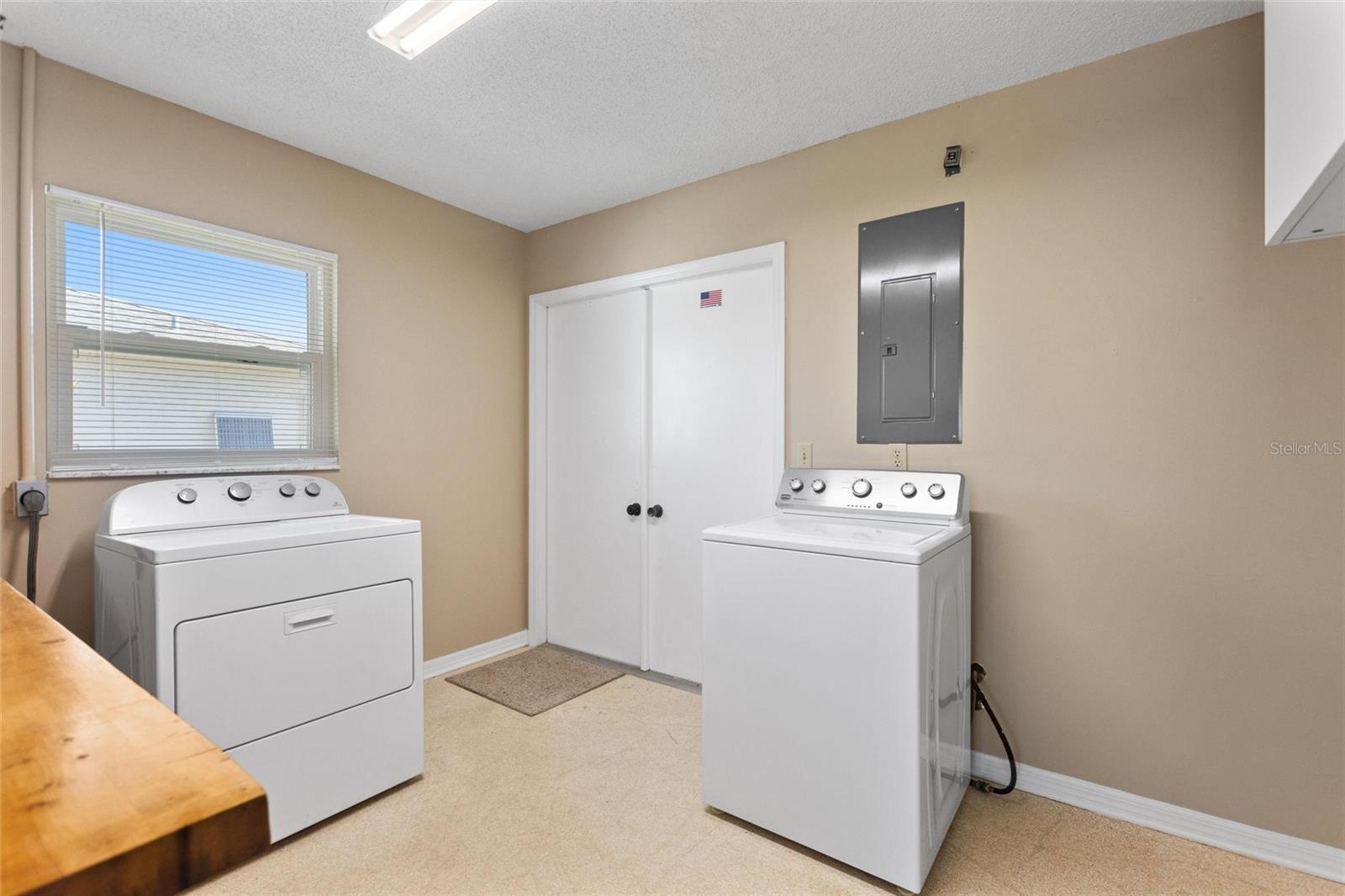 Spacious laundry room.  Double doors lead out to garage