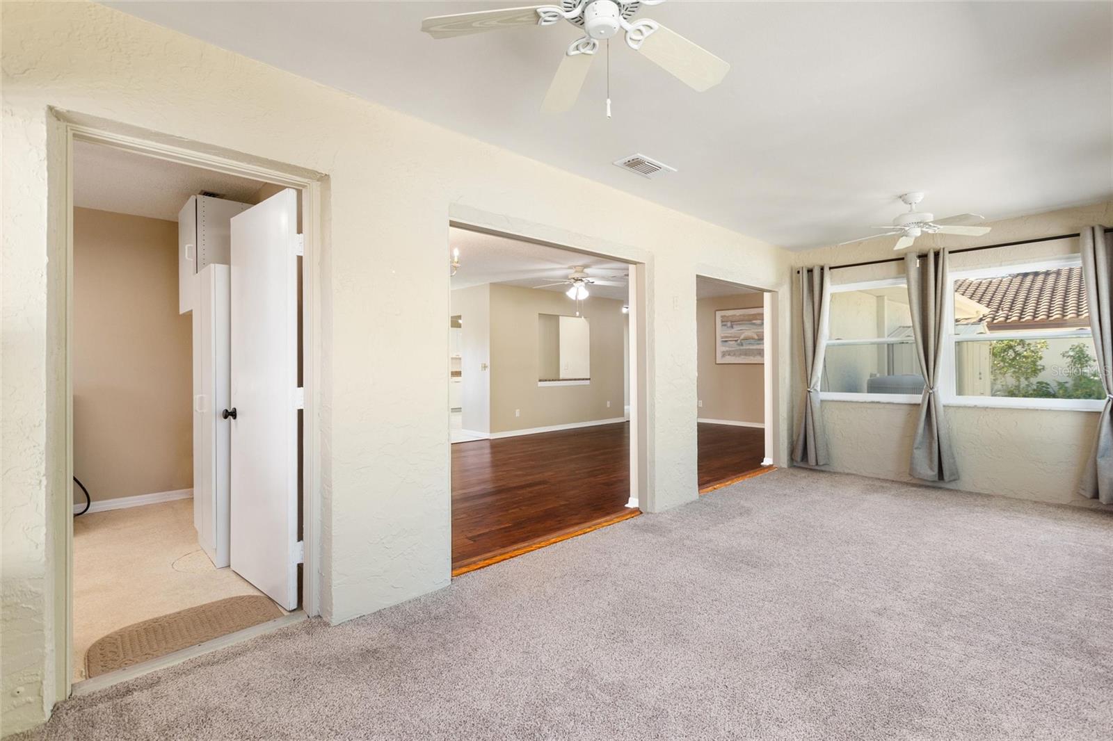 Florida room with view back into living and dining areas