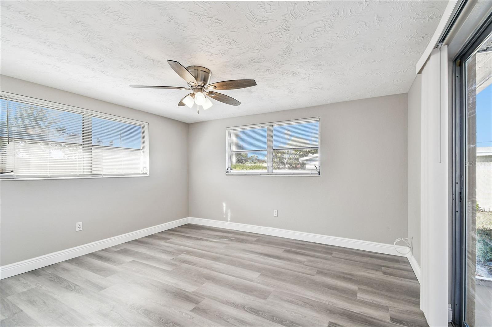 Back bedroom with sliding glass door