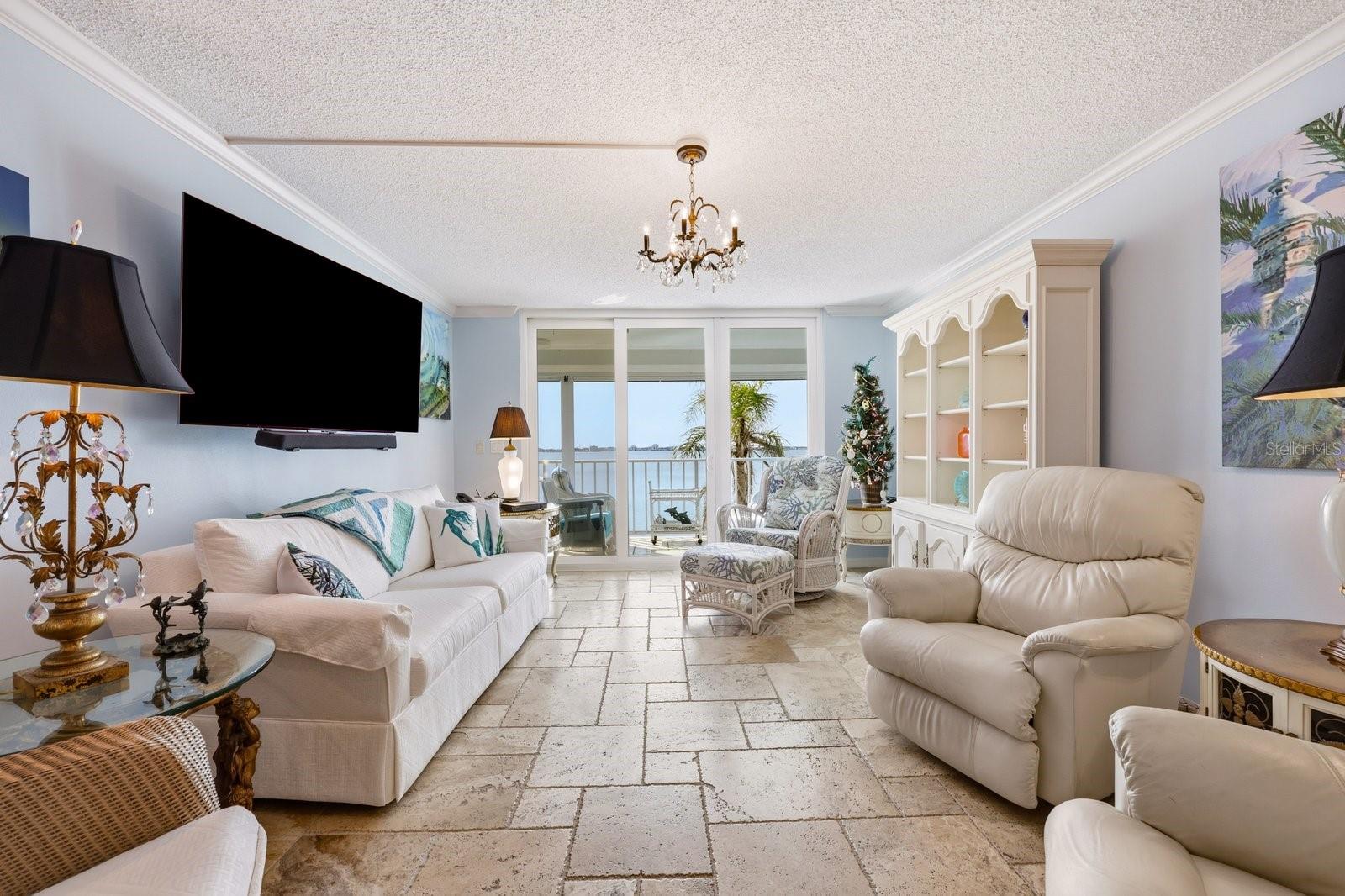 Polished travertine in French pattern throughout the home.