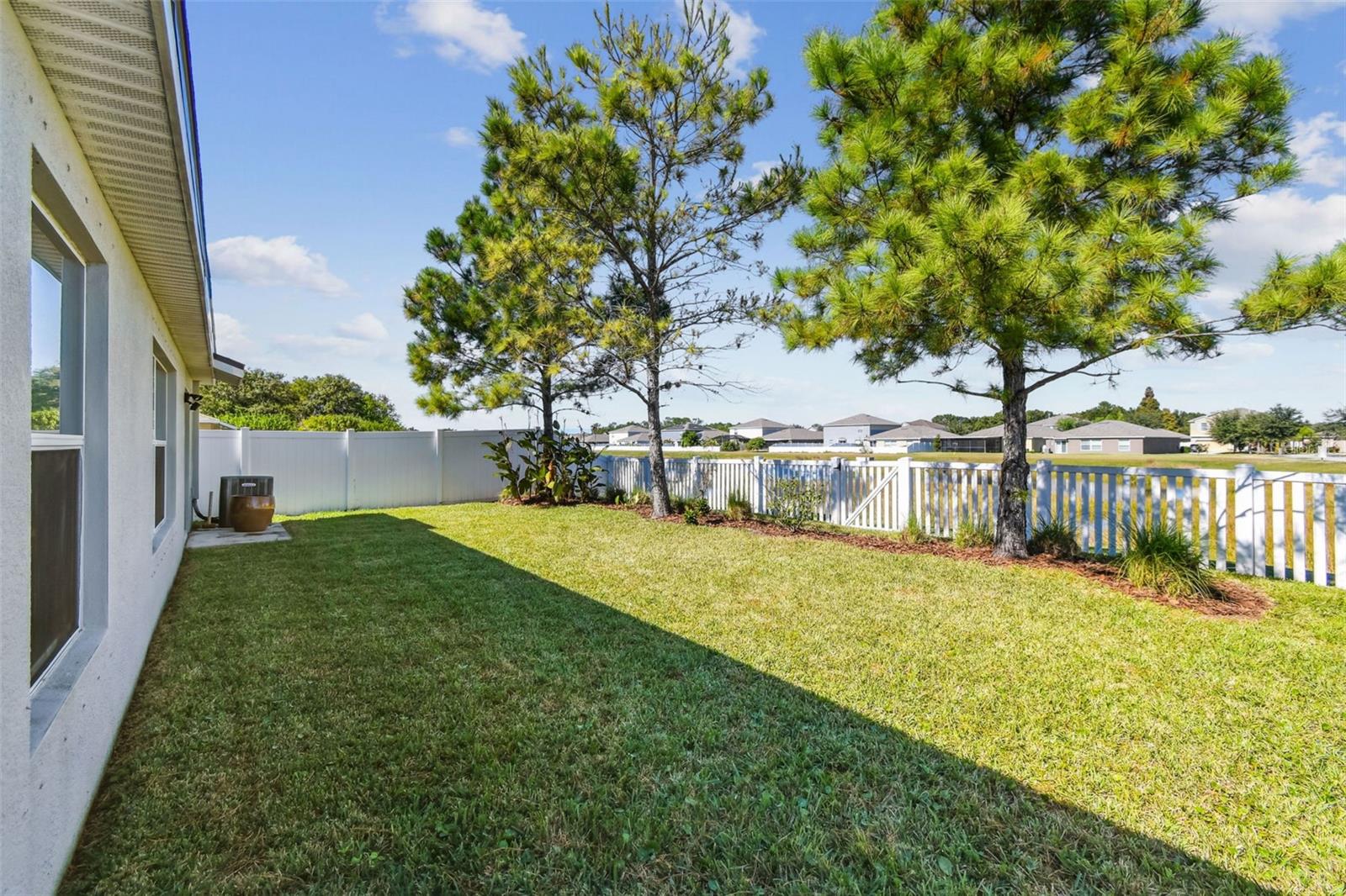 Rear of home overlooks the pond