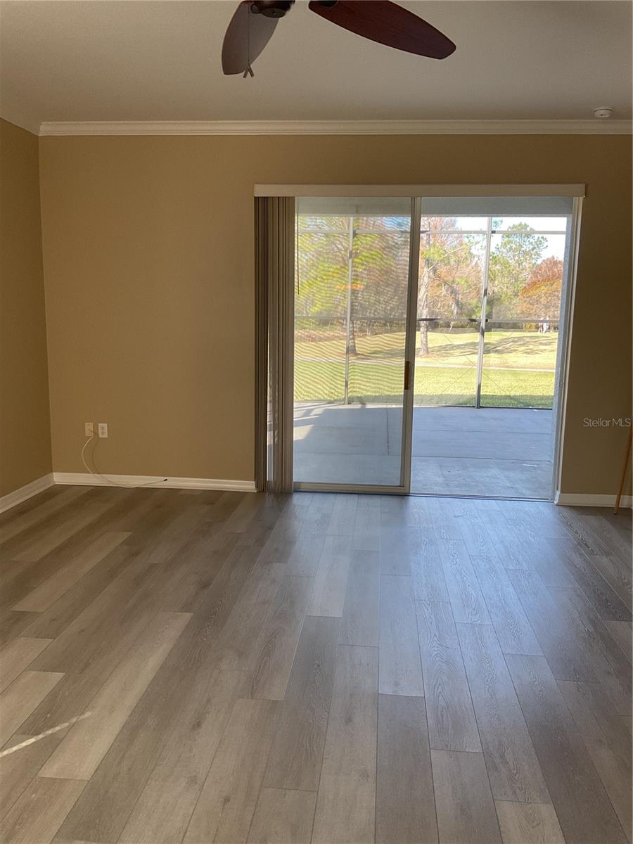 VIEW OF LIVING ROOM OUT TO SCREENED LANAI