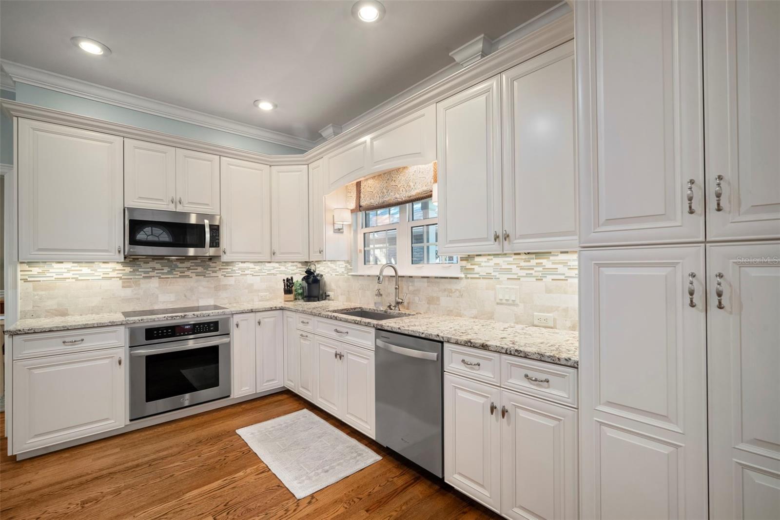 Induction cooktop with convection oven below.