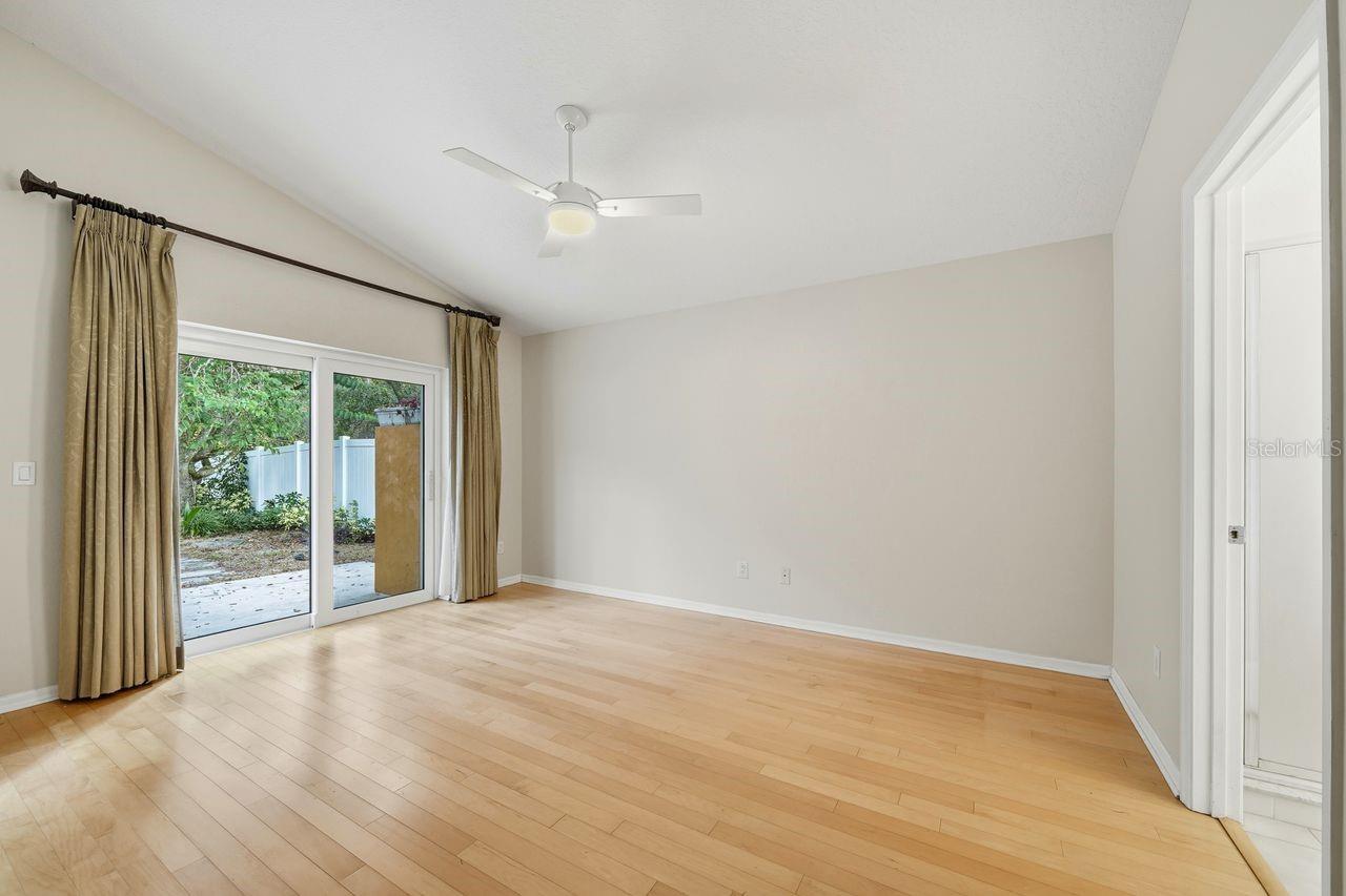 Primary Bedroom sliders to backyard