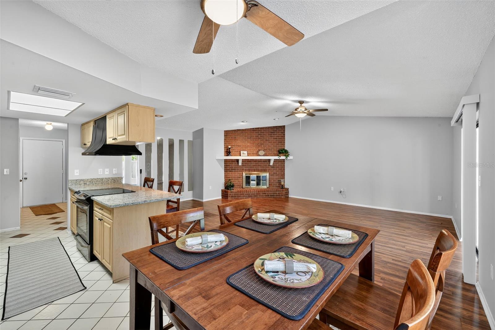 View of living room, dining room, and kitchen
