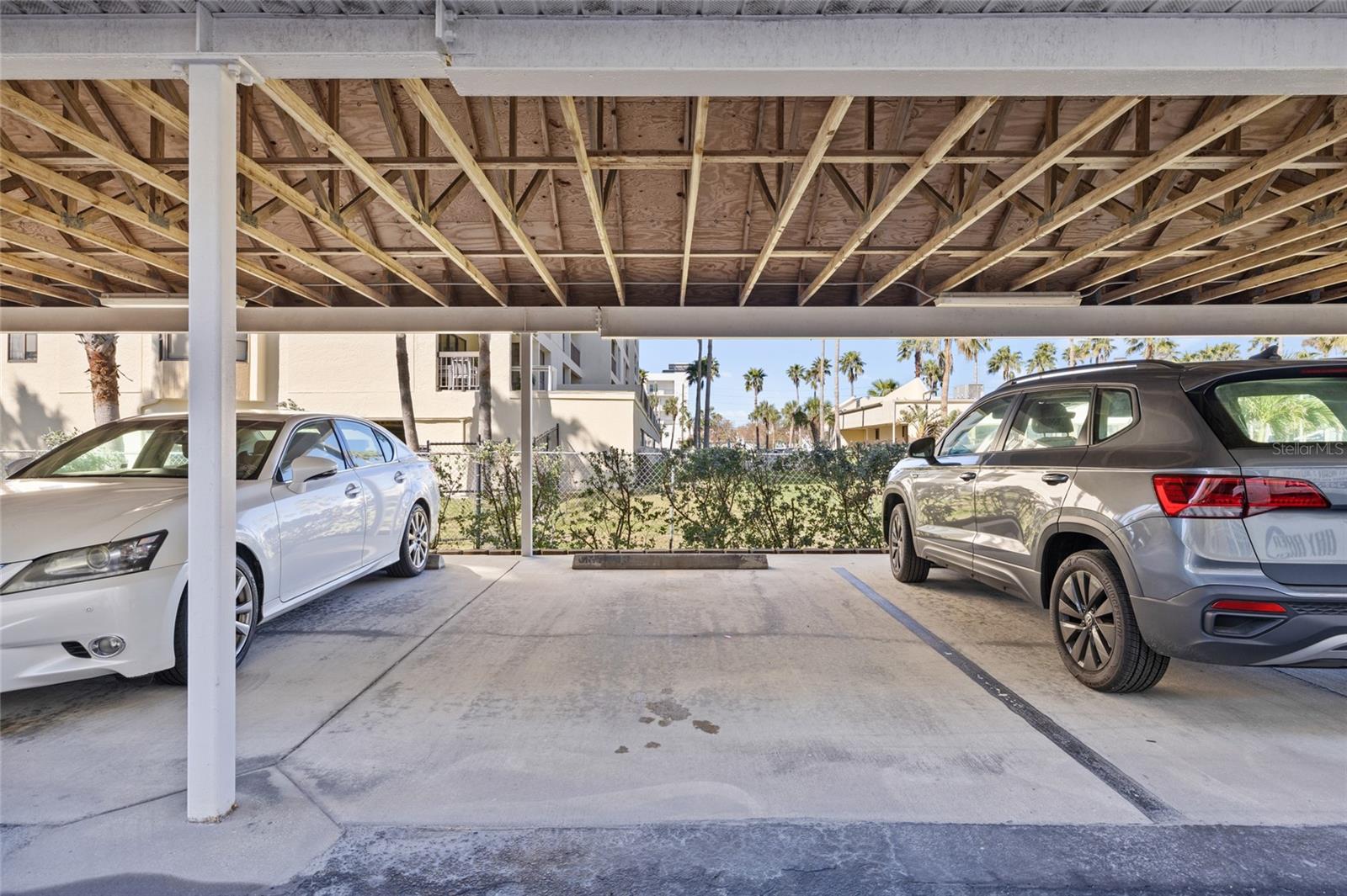 Assigned parking under carport.