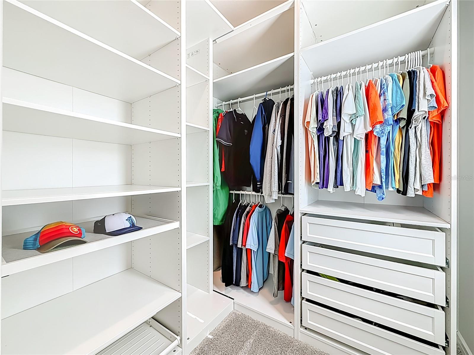 Walk-in Closet with pull out drawers and slide out shelves