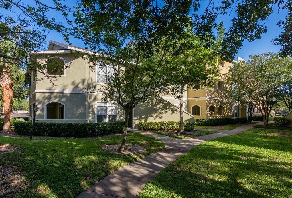 Manicured pathways and tropiical plants compliment the community