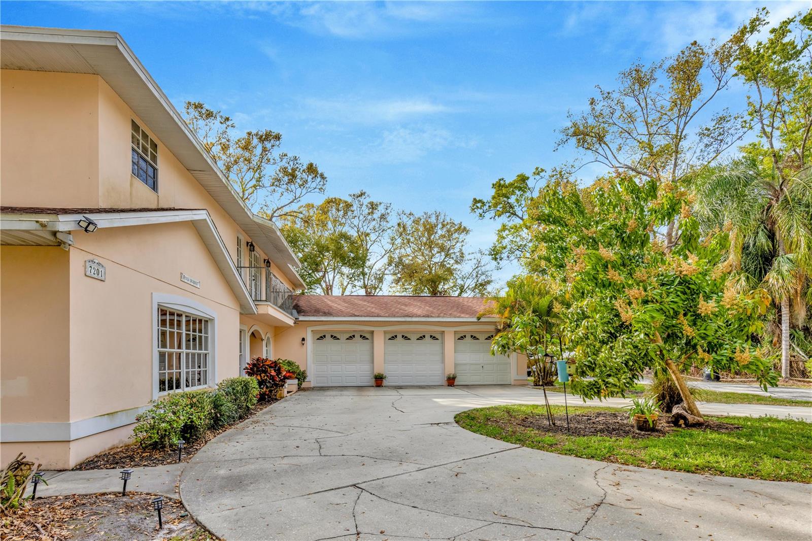 The ample three car garage is easily accessed by the circular driveway.
