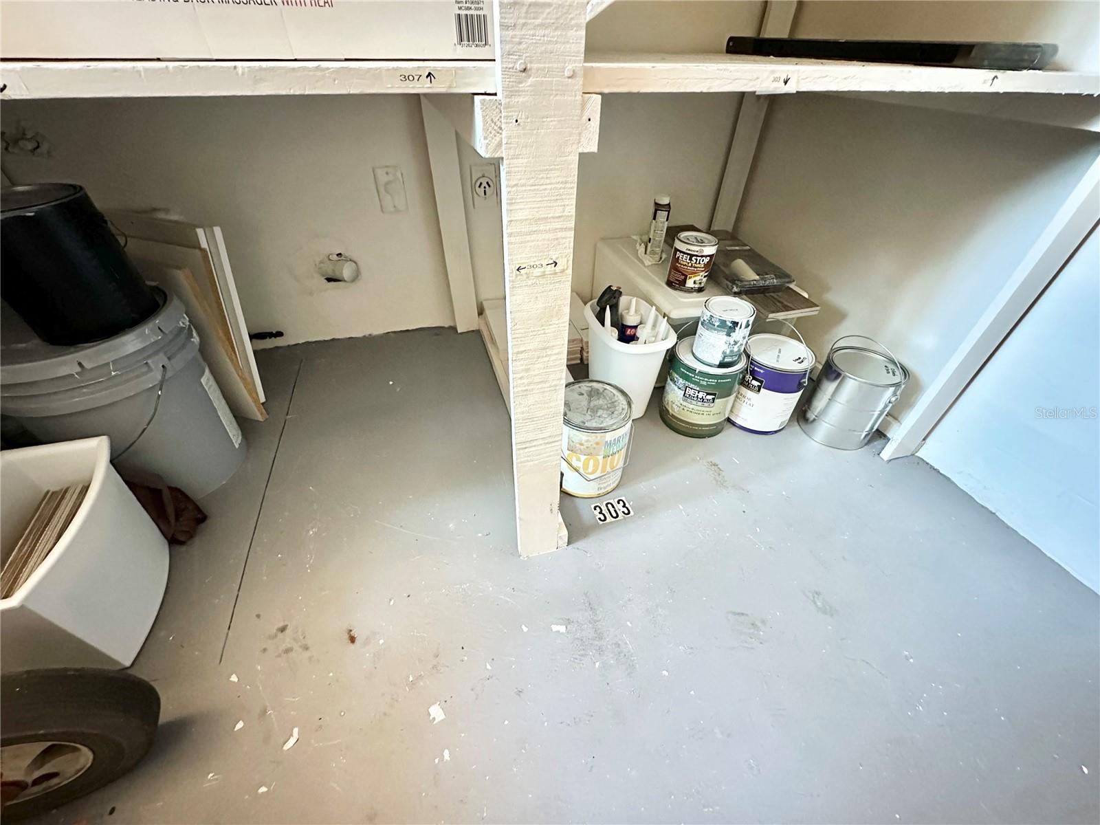 Storage area for #303 (line on left side of space dilutes boundary).