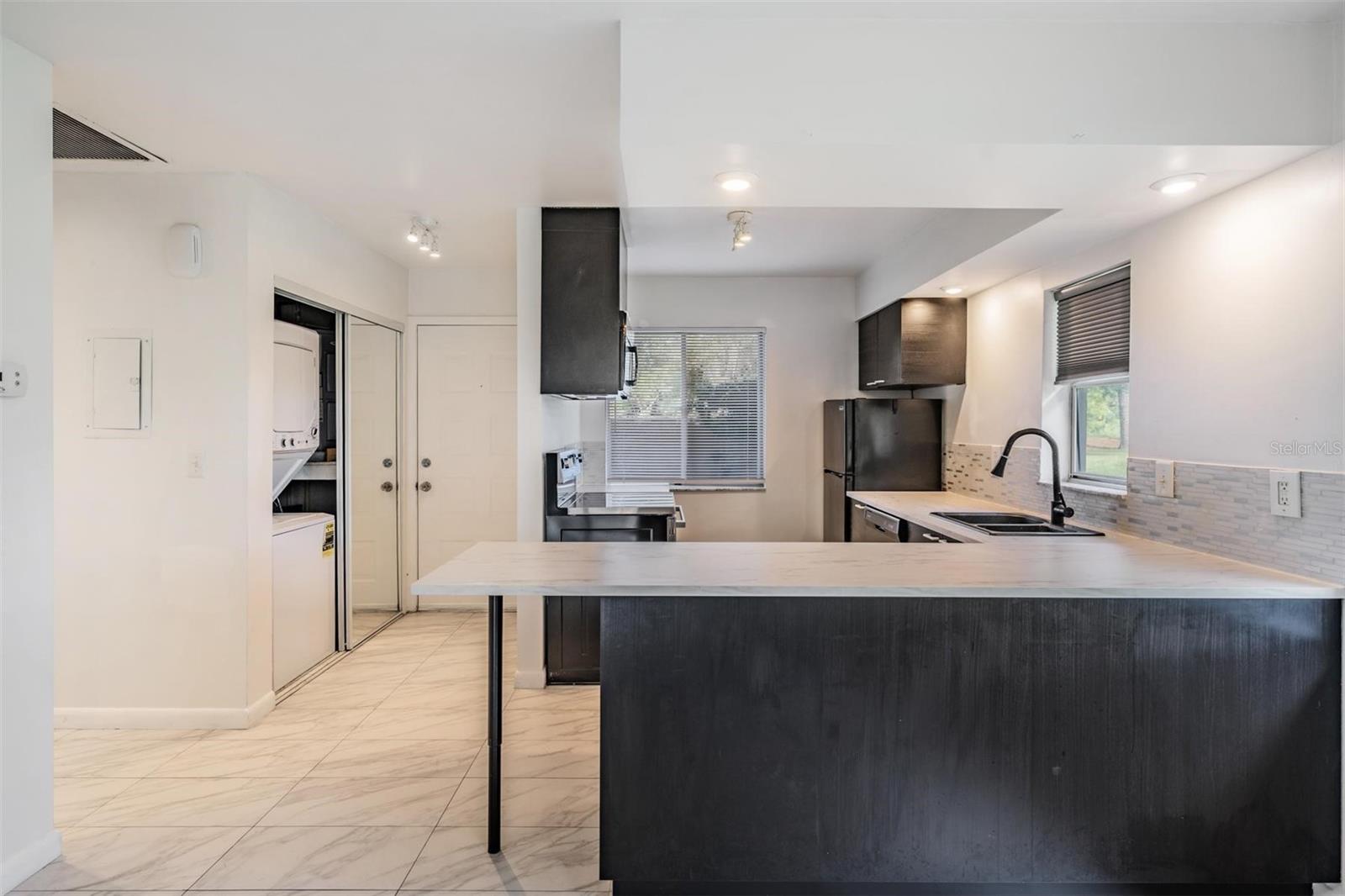 Open-concept kitchen flows seamlessly into the Great Room — perfect for entertaining.