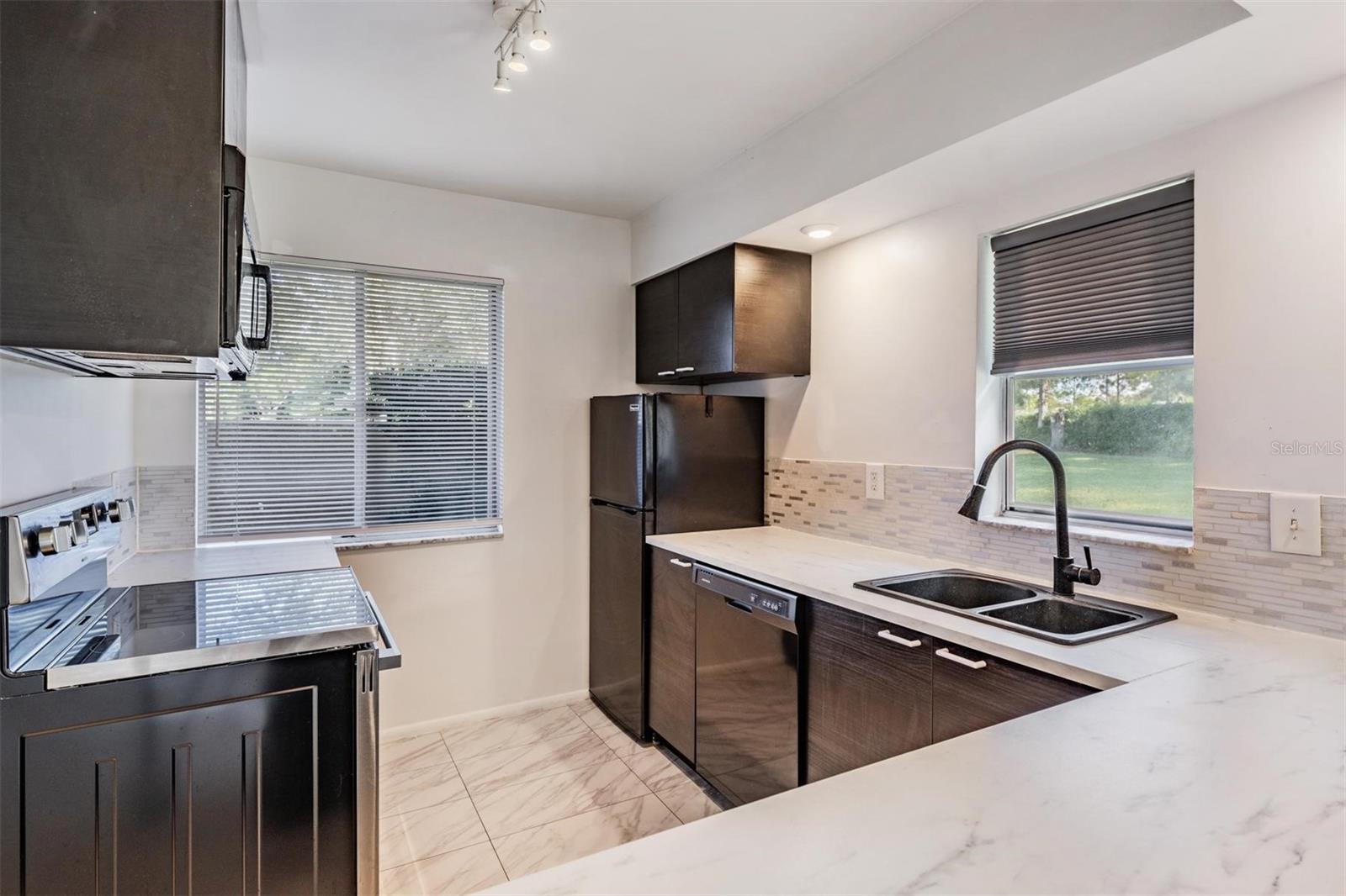 Open-concept kitchen flows seamlessly into the Great Room — perfect for entertaining.