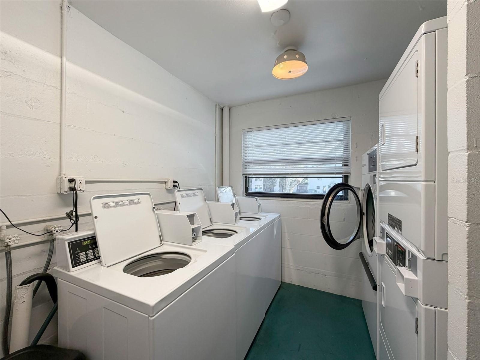 Laundry facility located outside of the unit