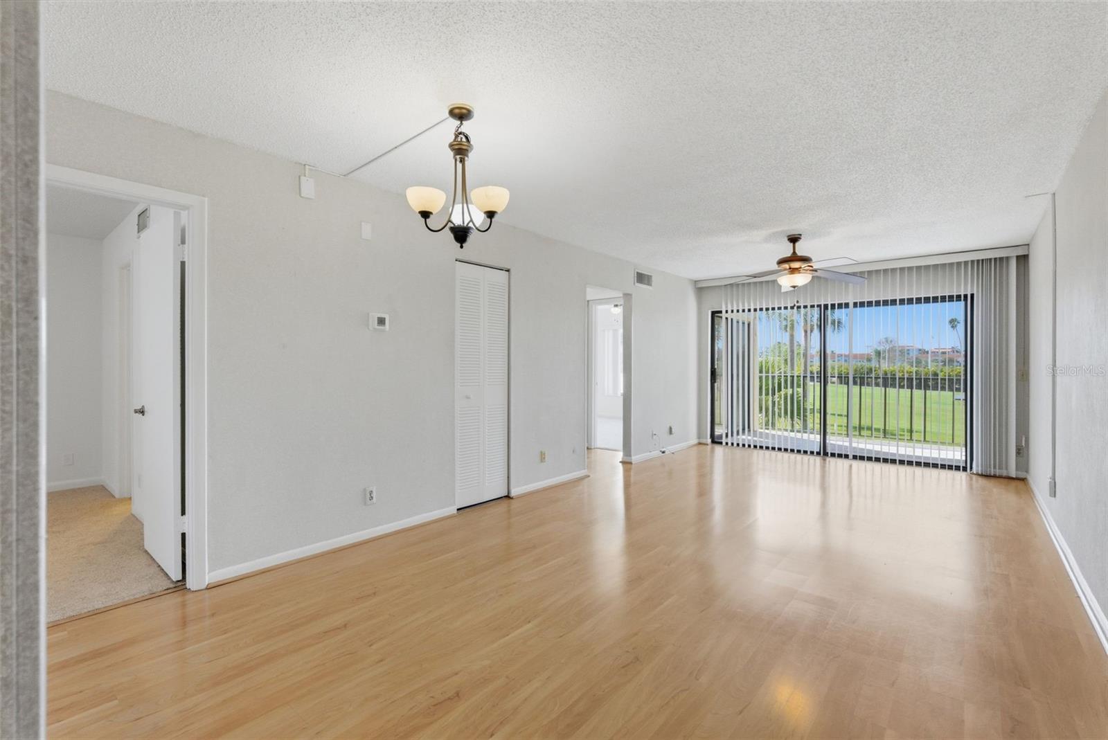 Entry into living room with golf coarse view