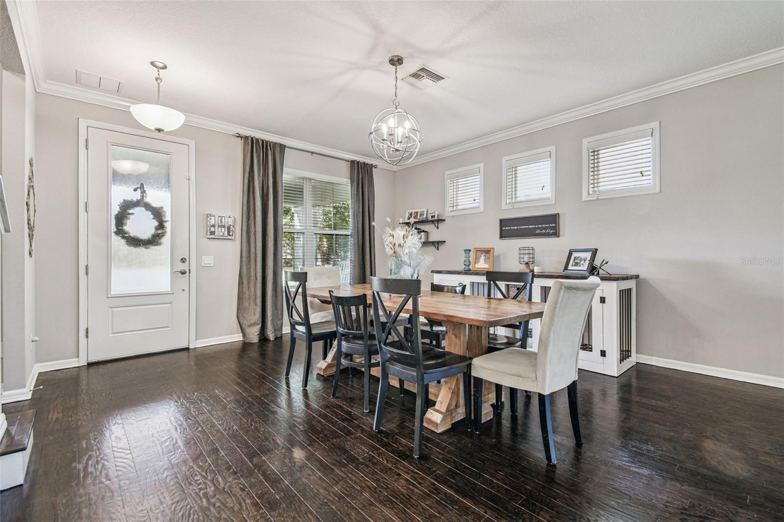 STAINED REAL WOOD FLOORING THROUGHOUT THE MAIN LEVEL
