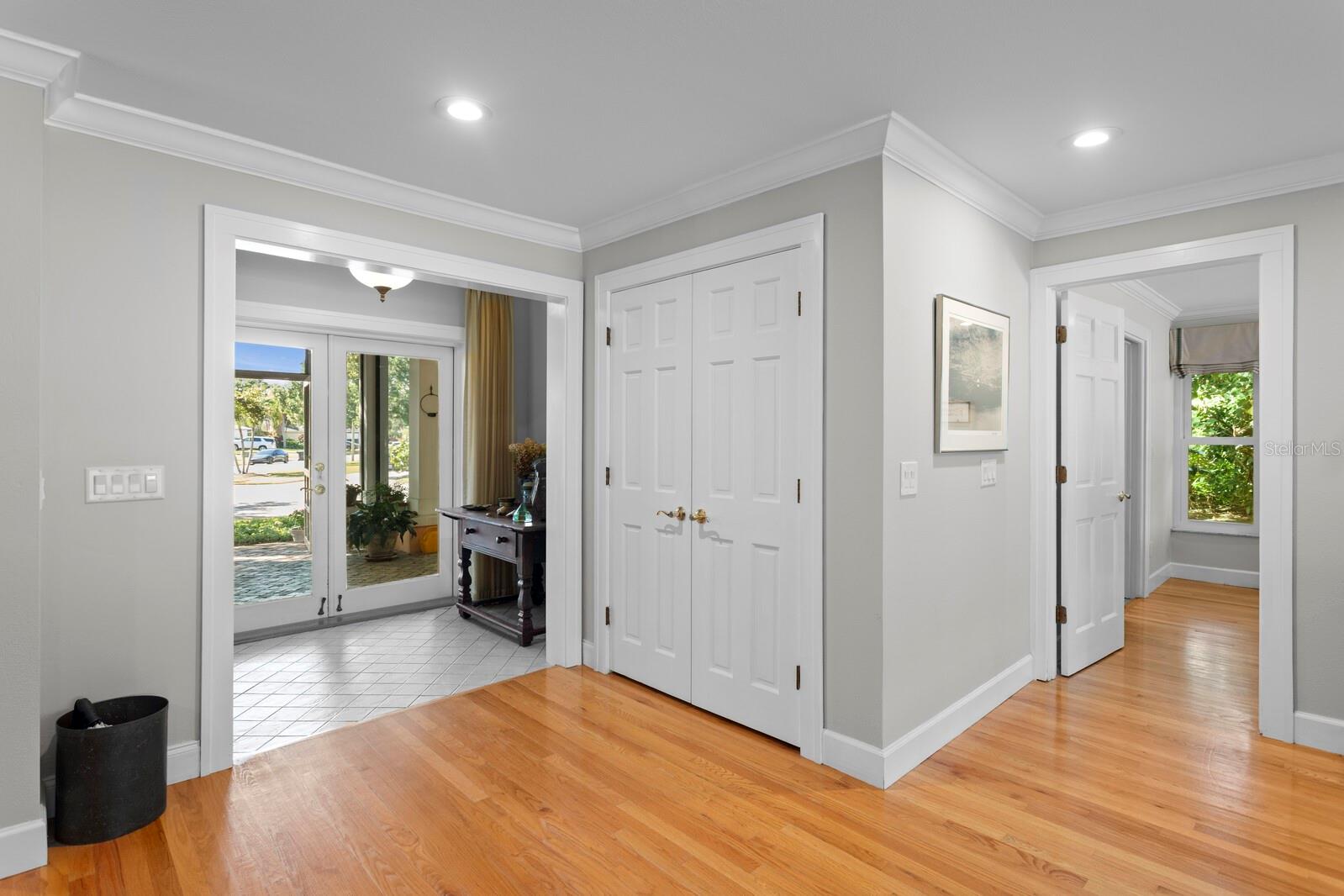 Formal Entry, closet, and primary bedroom