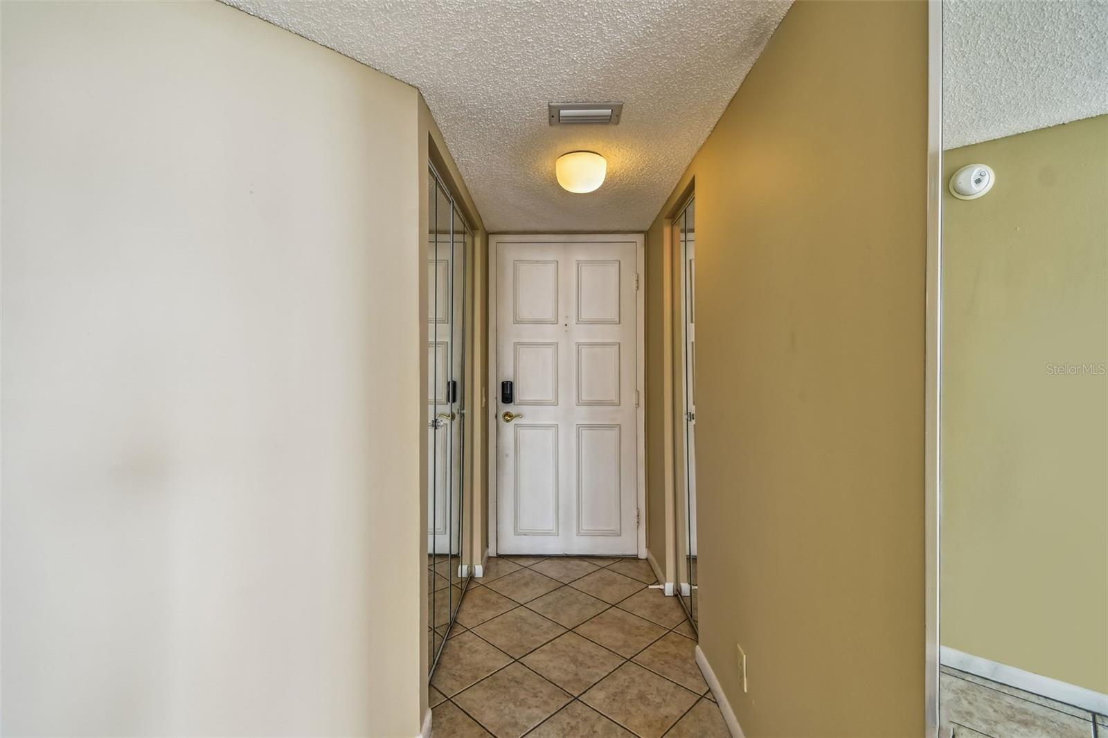 Foyer with two storage closets
