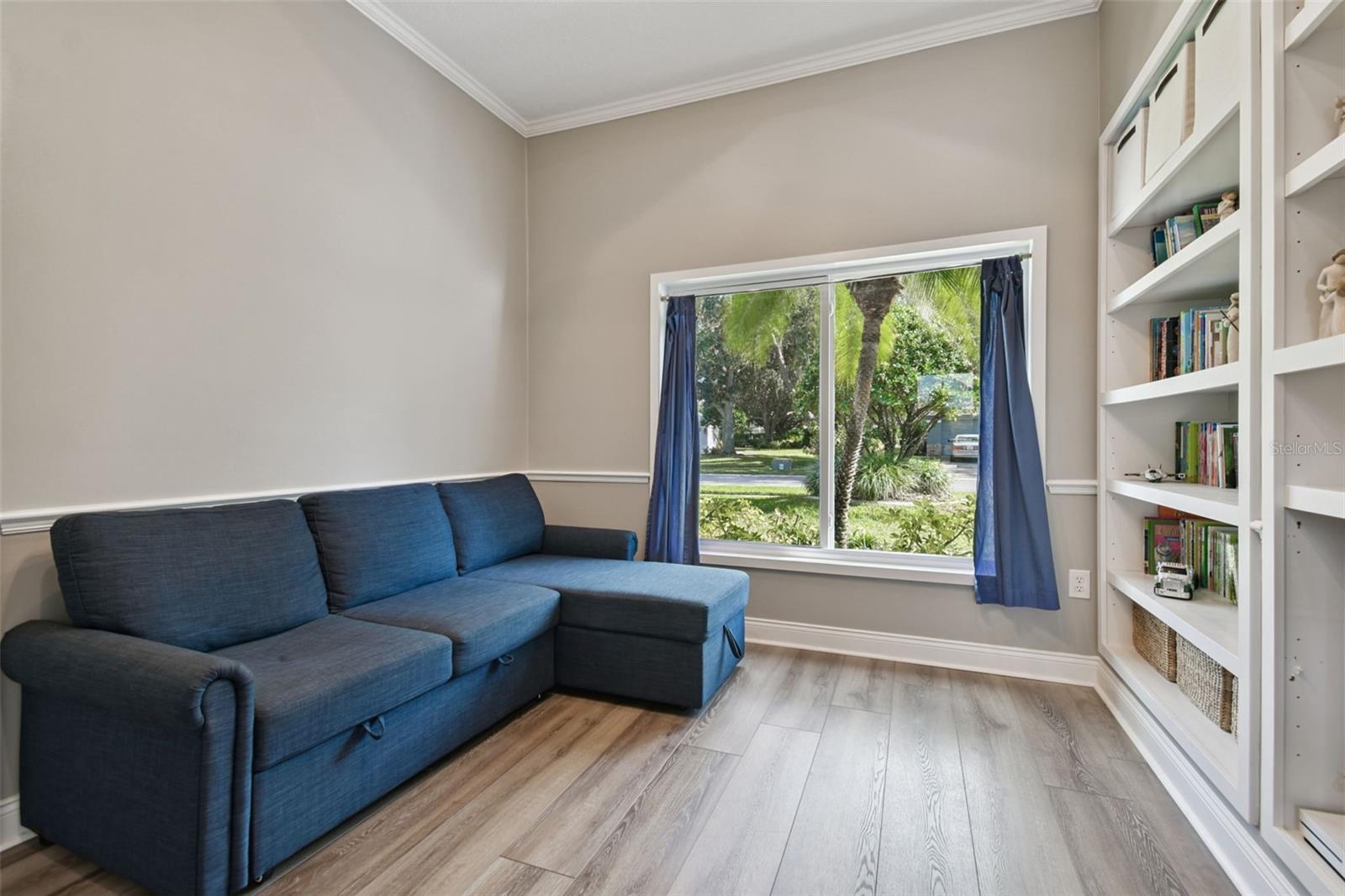 Flex Space with built in shelving and a closet - could be a den/office or 5th bedroom