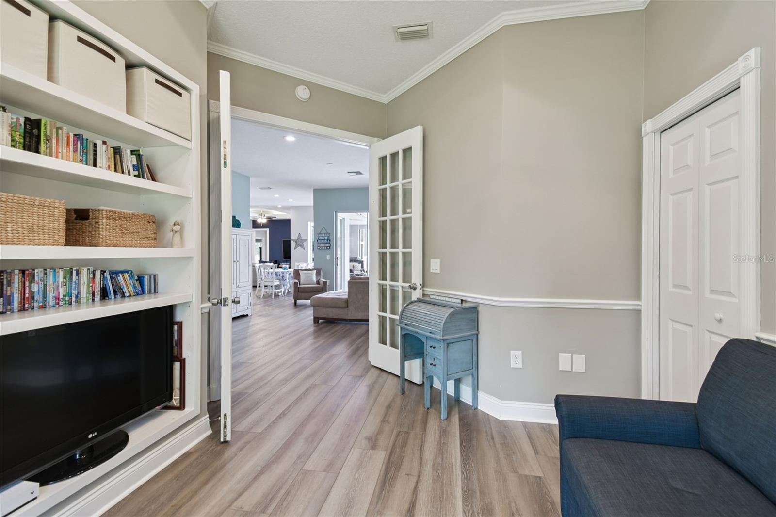 Flex Space with built in shelving and a closet - could be a den/office or 5th bedroom