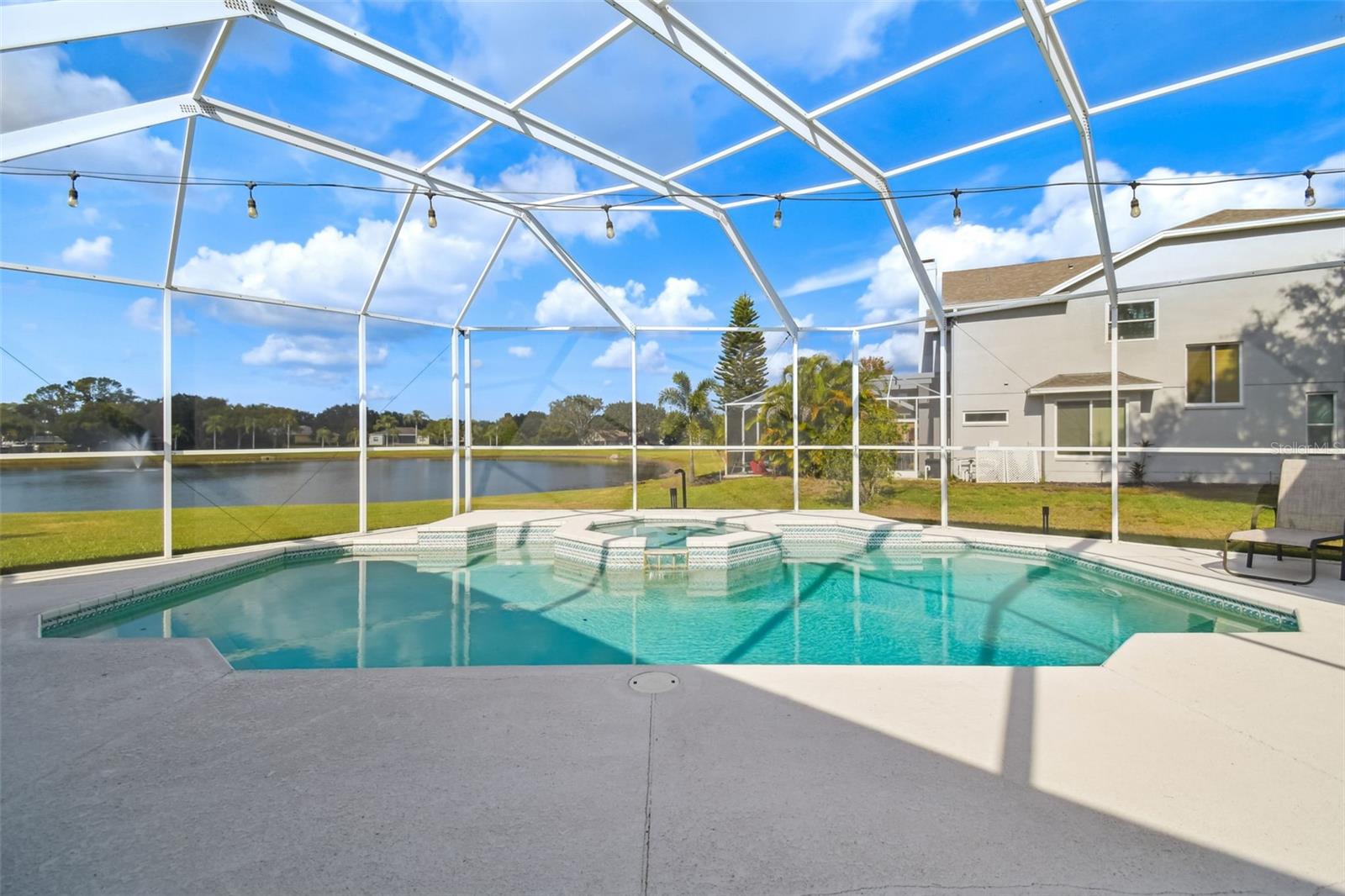 Salt water heated pool and spa overlooking lovely pond where you can enjoy stunning sunsets