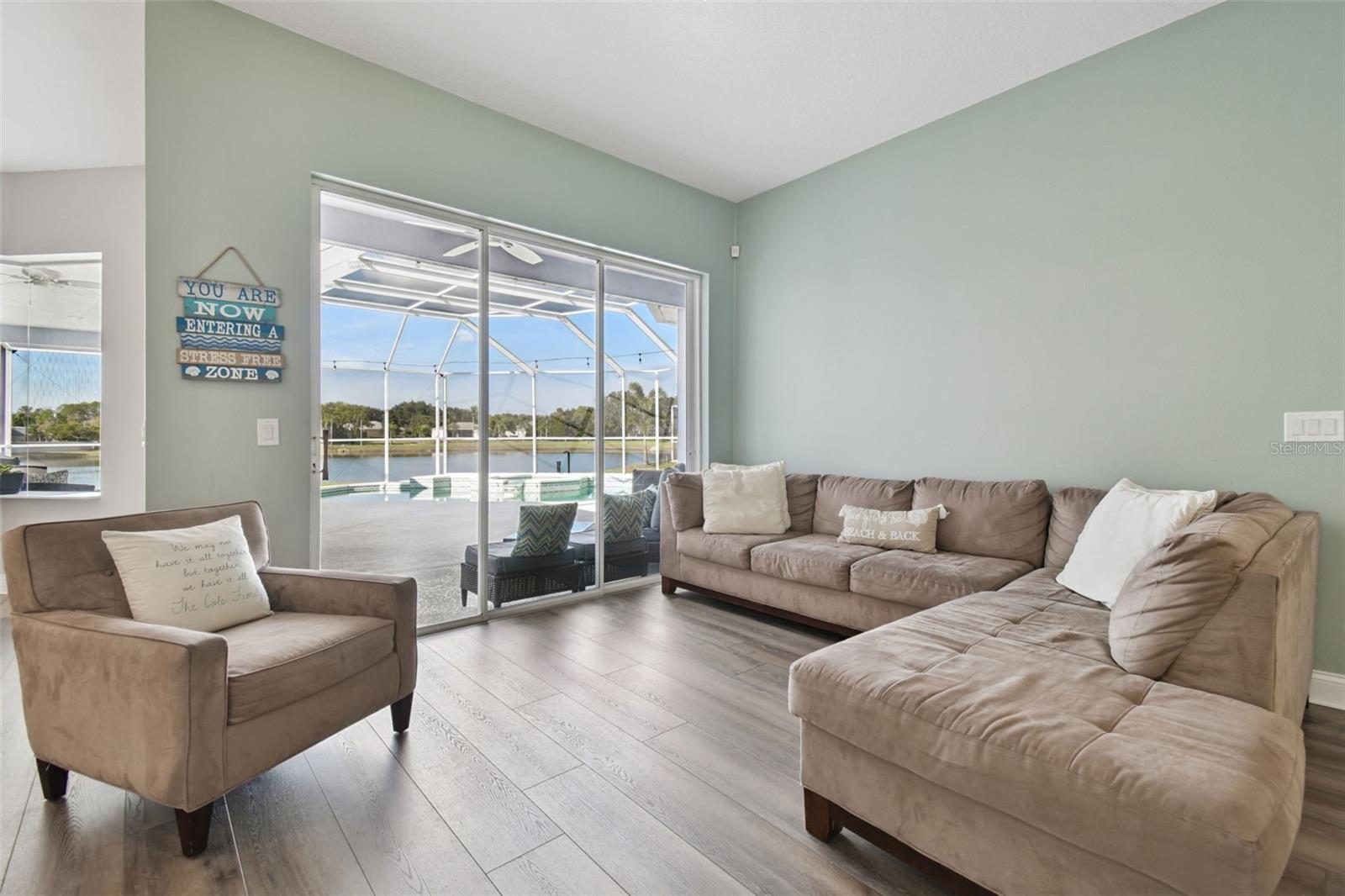 Living room overlooking the pool and pond