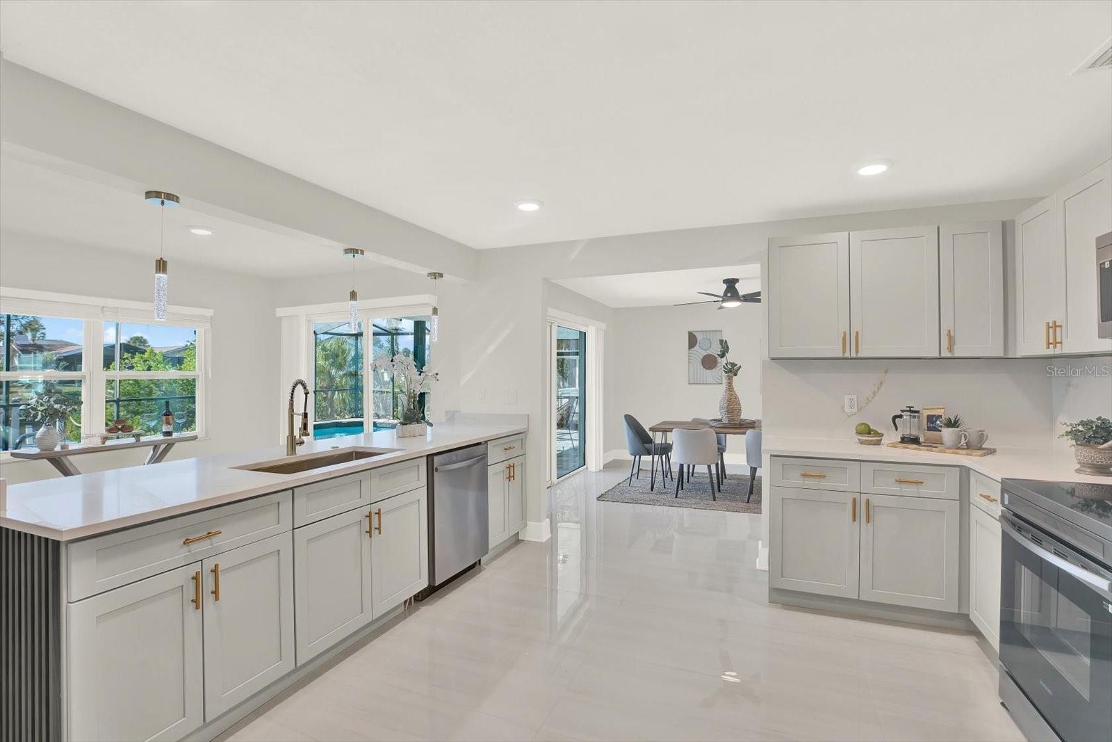 Modern kitchen with Quartz & soft close wood cabinets. New Samsung appliance pkg.