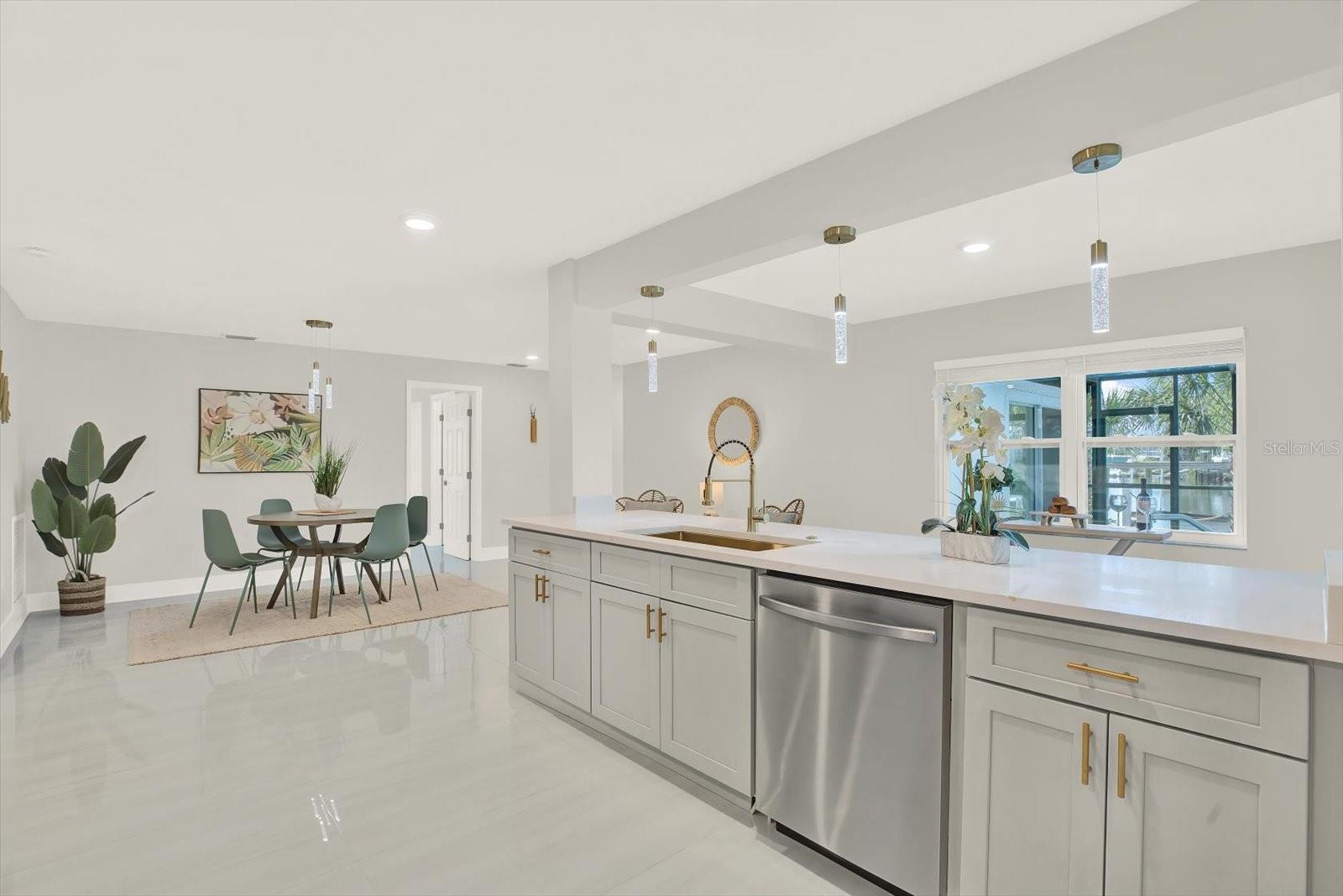 Spacious open modern kitchen.  Water | sunset view