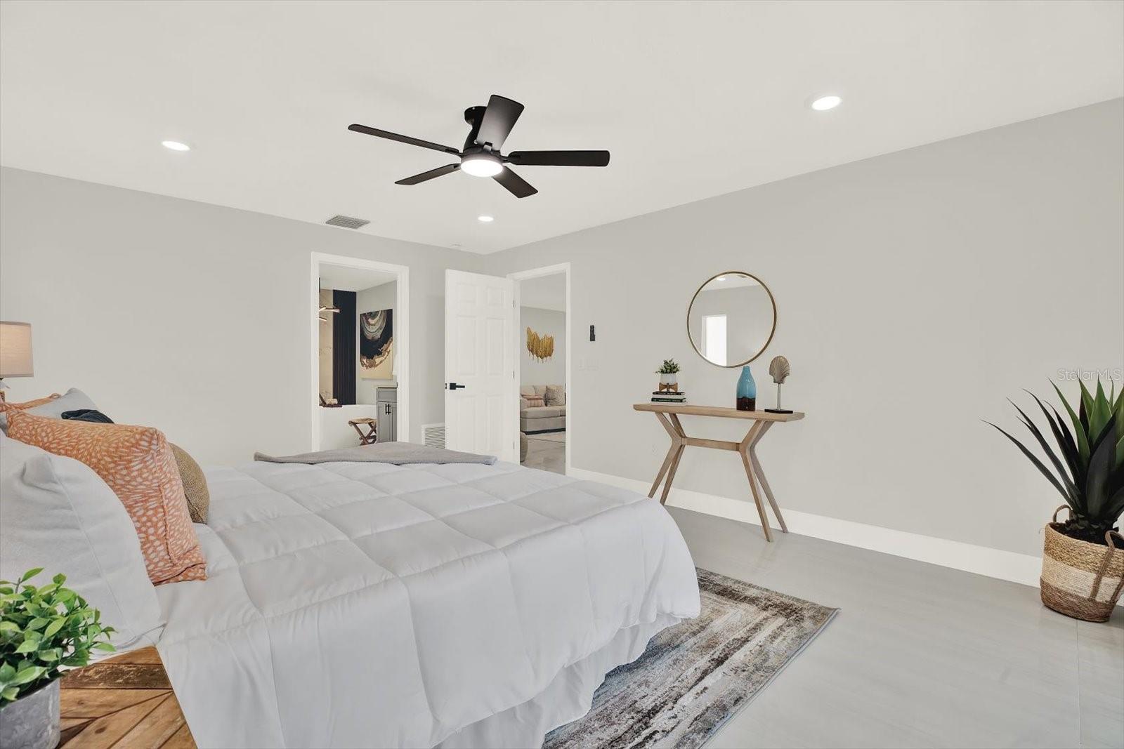 Primary bedroom offers pool access + lux spa en suite bath + walk in closet