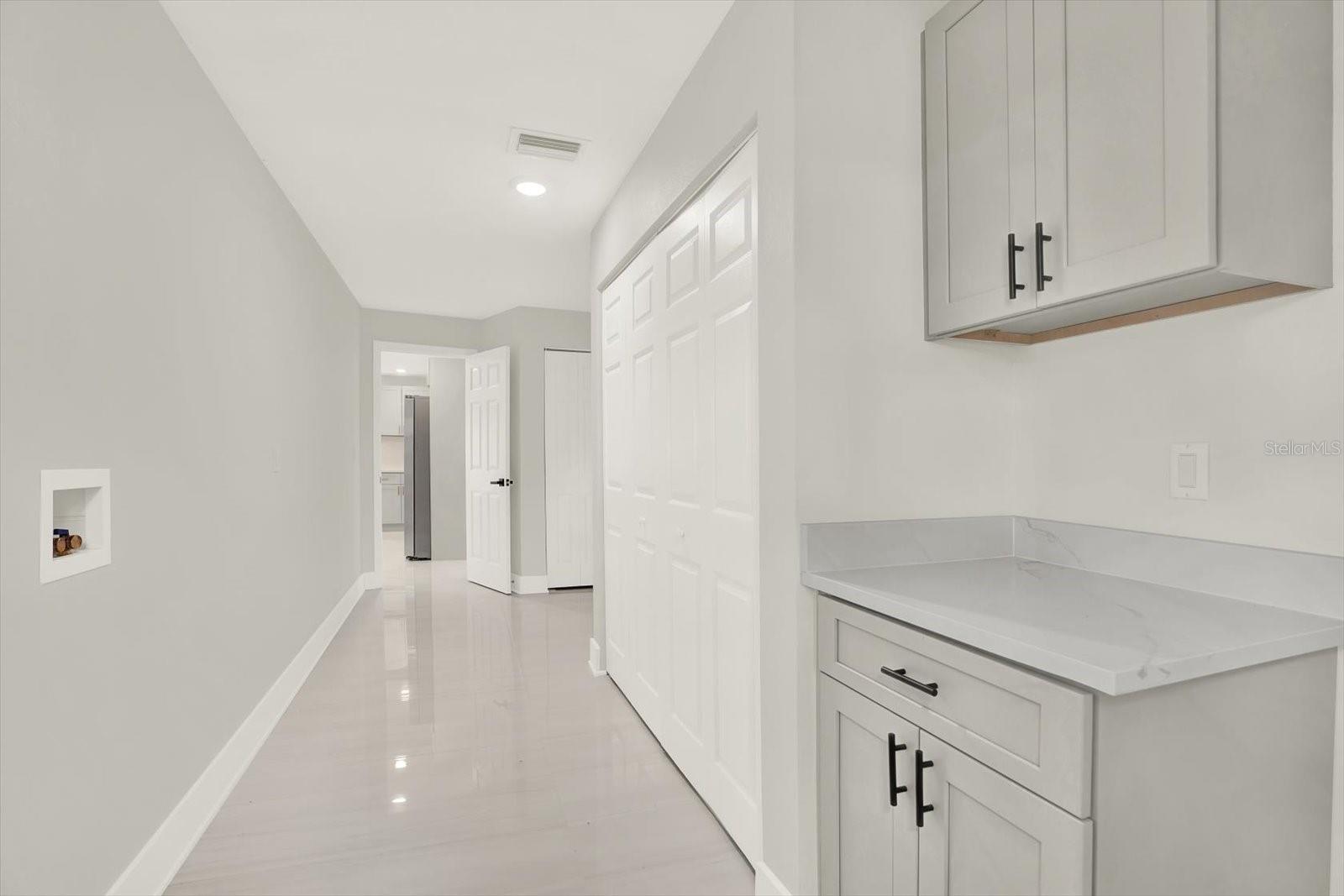 Lux Laundry room.  Oversized pantry + extra closet storage.   Adjacent to Kitchen & garage