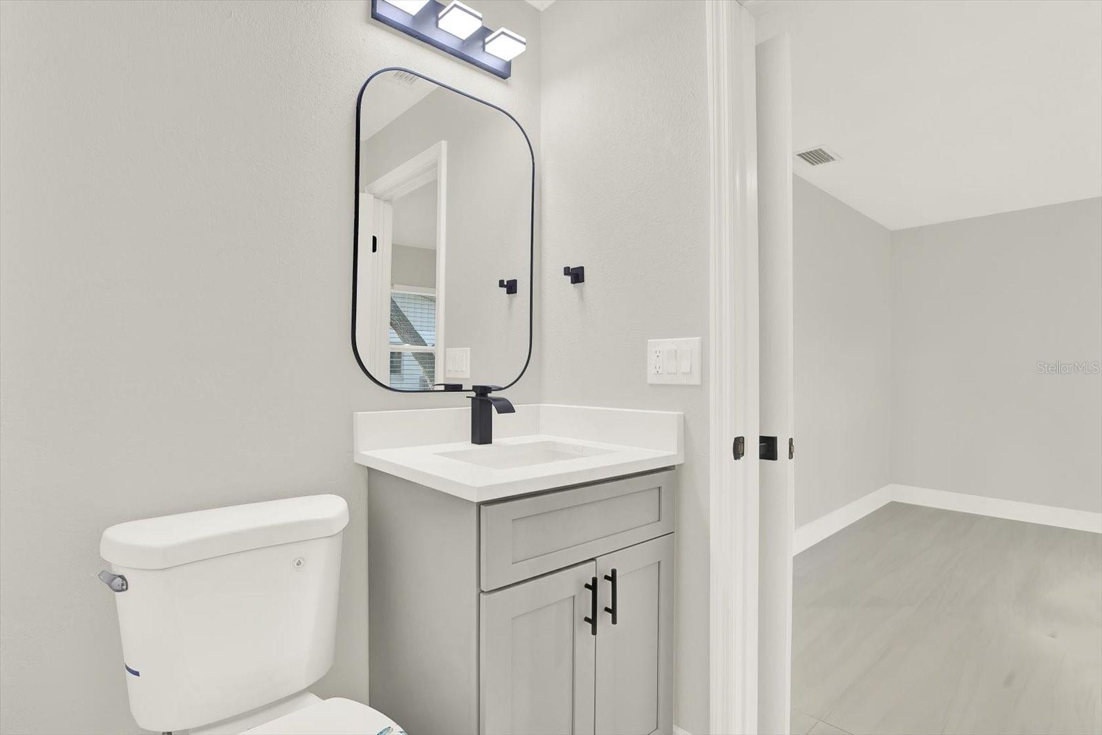 Jack & Jill bath each have toilet | vanity and they share a shower space