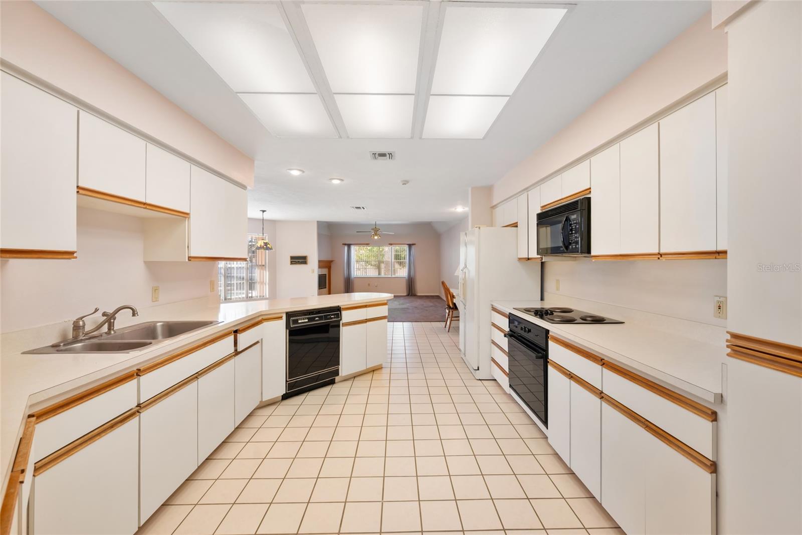 Large kitchen with breakfast bar and pantry