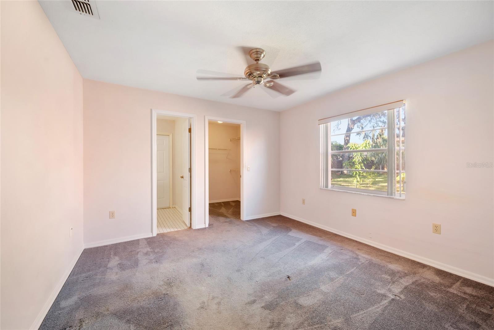 2nd Bedroom with en suite 1/2 bath and walk in closet.